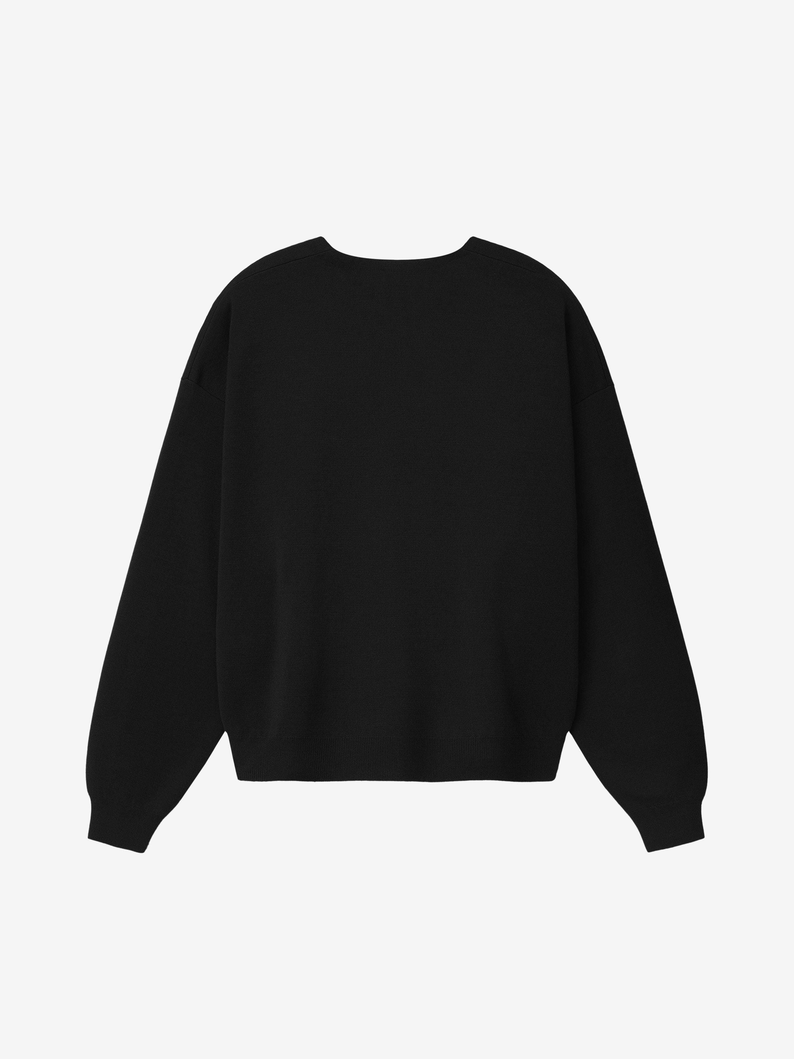 back view of men's black relaxed fit Merino Milano knit crewneck sweater with long sleeves and ribbed cuffs