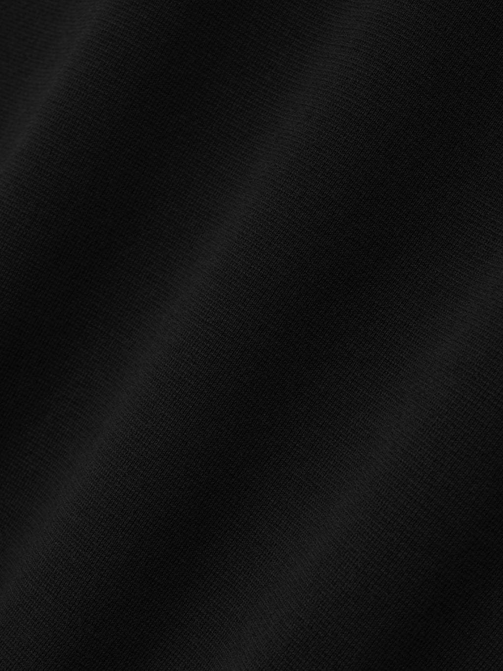 black Merino Milano stitch fabric texture with subtle mesh knit detail in lightweight Italian wool blend