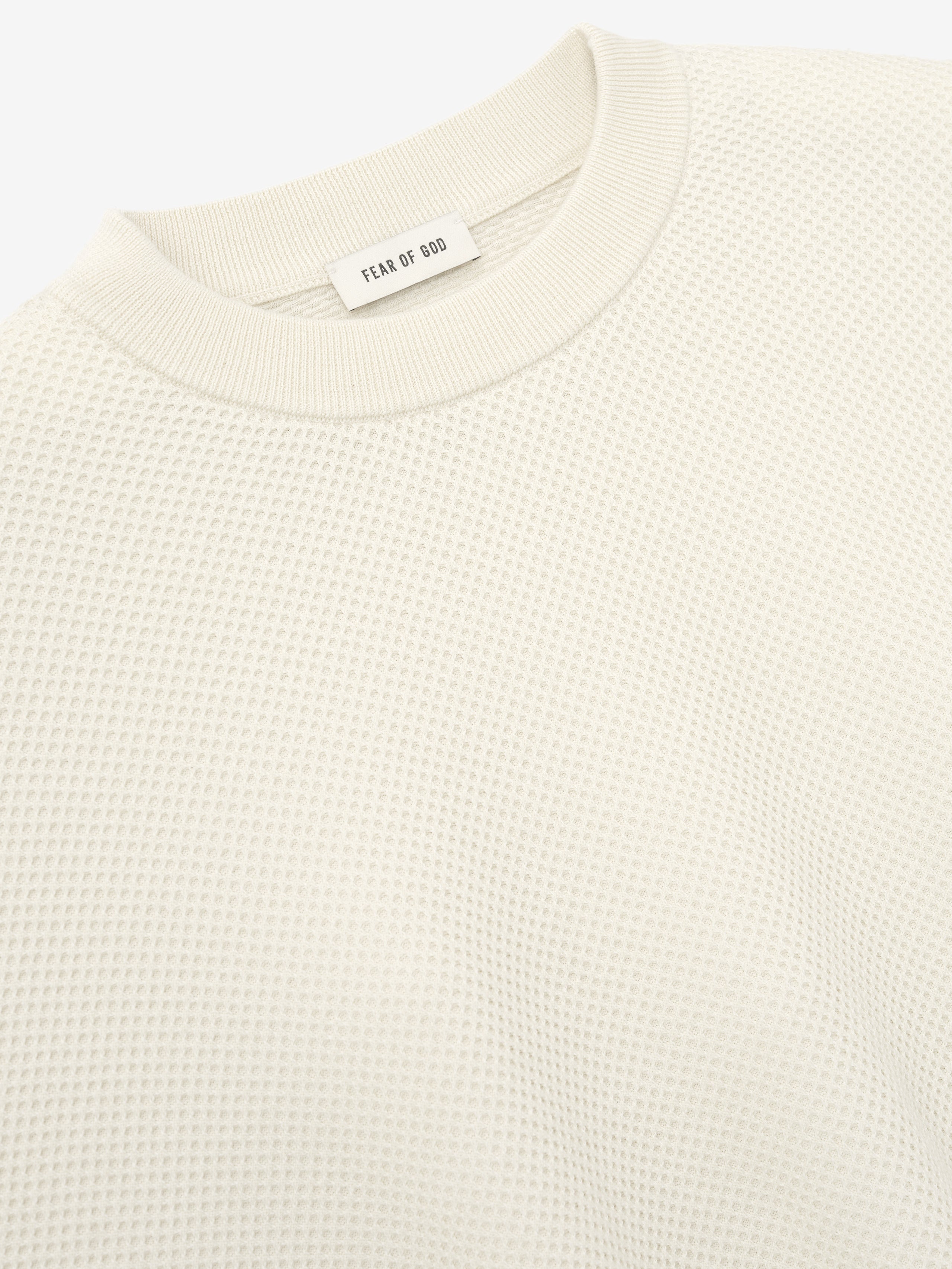 close-up of off-white double-knit sport mesh wool-cotton crewneck sweater with ribbed neckline detail
