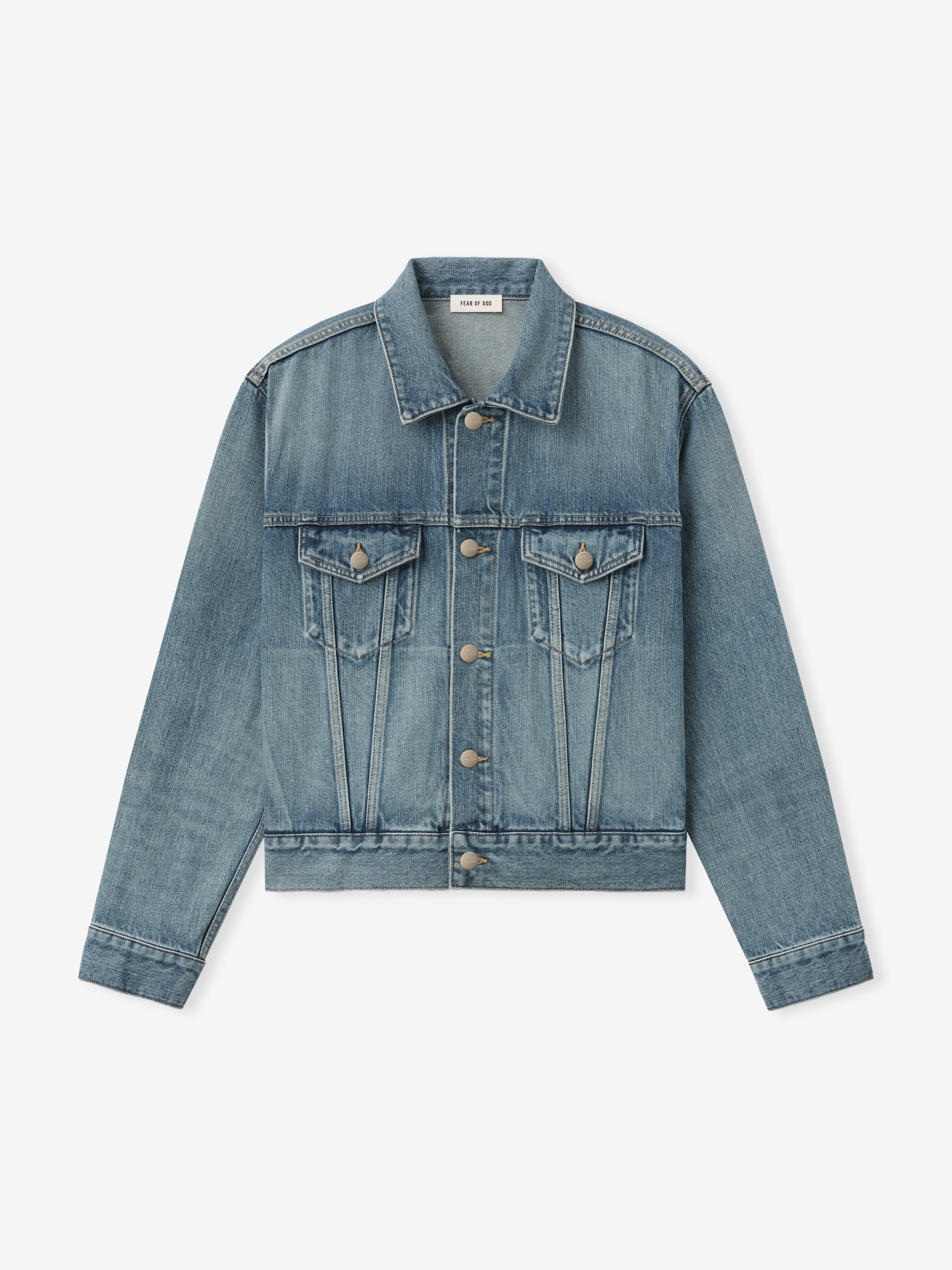 men's classic trucker jacket in medium indigo washed denim with chest flap pockets and metal button front closure
