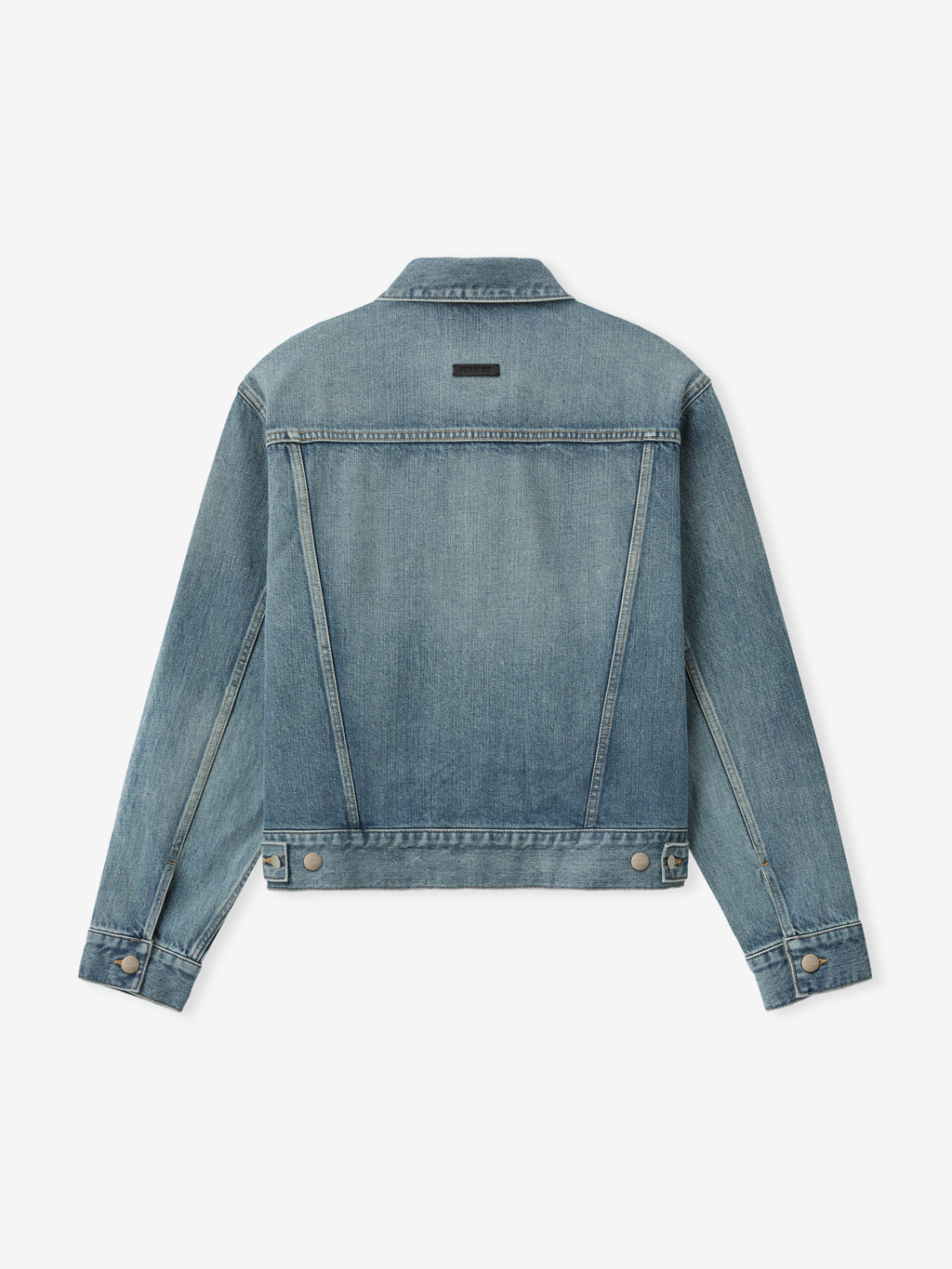 back view of men's classic trucker jacket in medium indigo denim with waistband tabs and subtle seam detailing