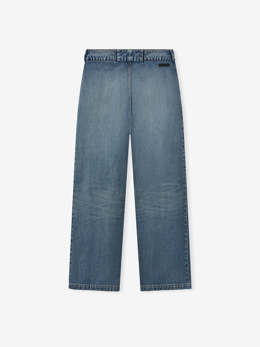 rear view of medium vintage wash relaxed fit denim utility pants with wide legs and subtle fading details