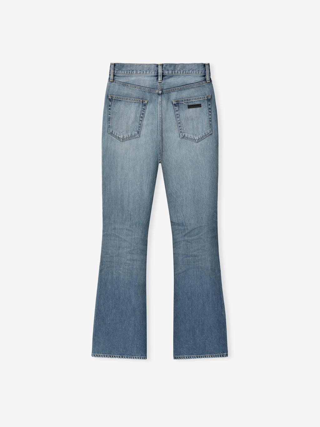 back view of classic blue indigo flared jeans with two patch pockets and subtle fading on lower legs