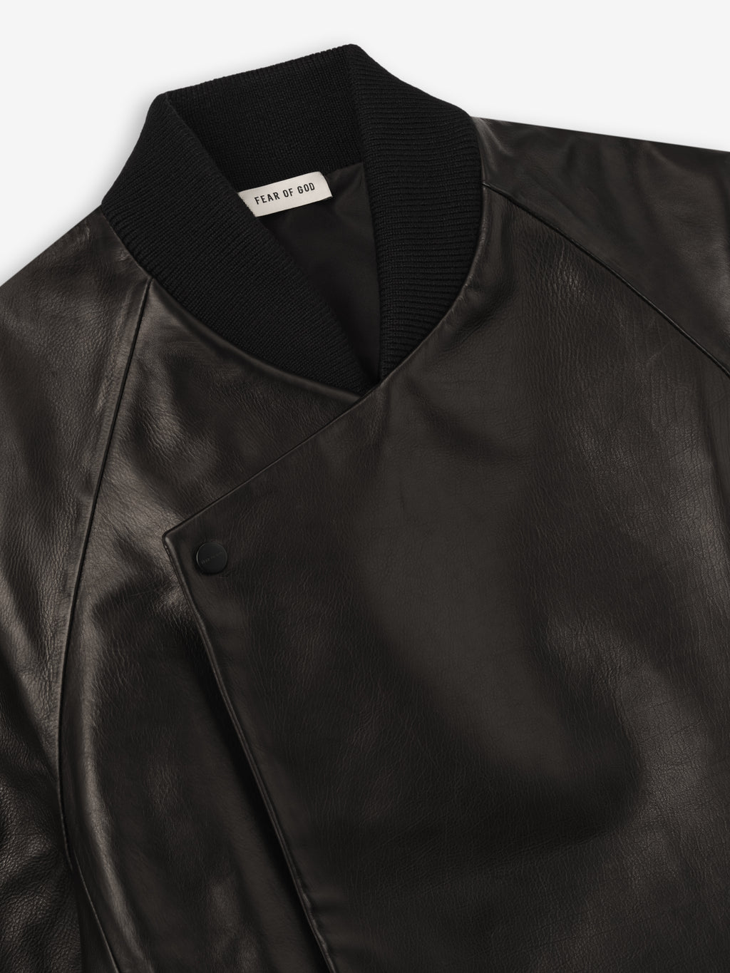 close-up of black full grain calfskin raglan bomber jacket with snap button front and rib knit collar detail