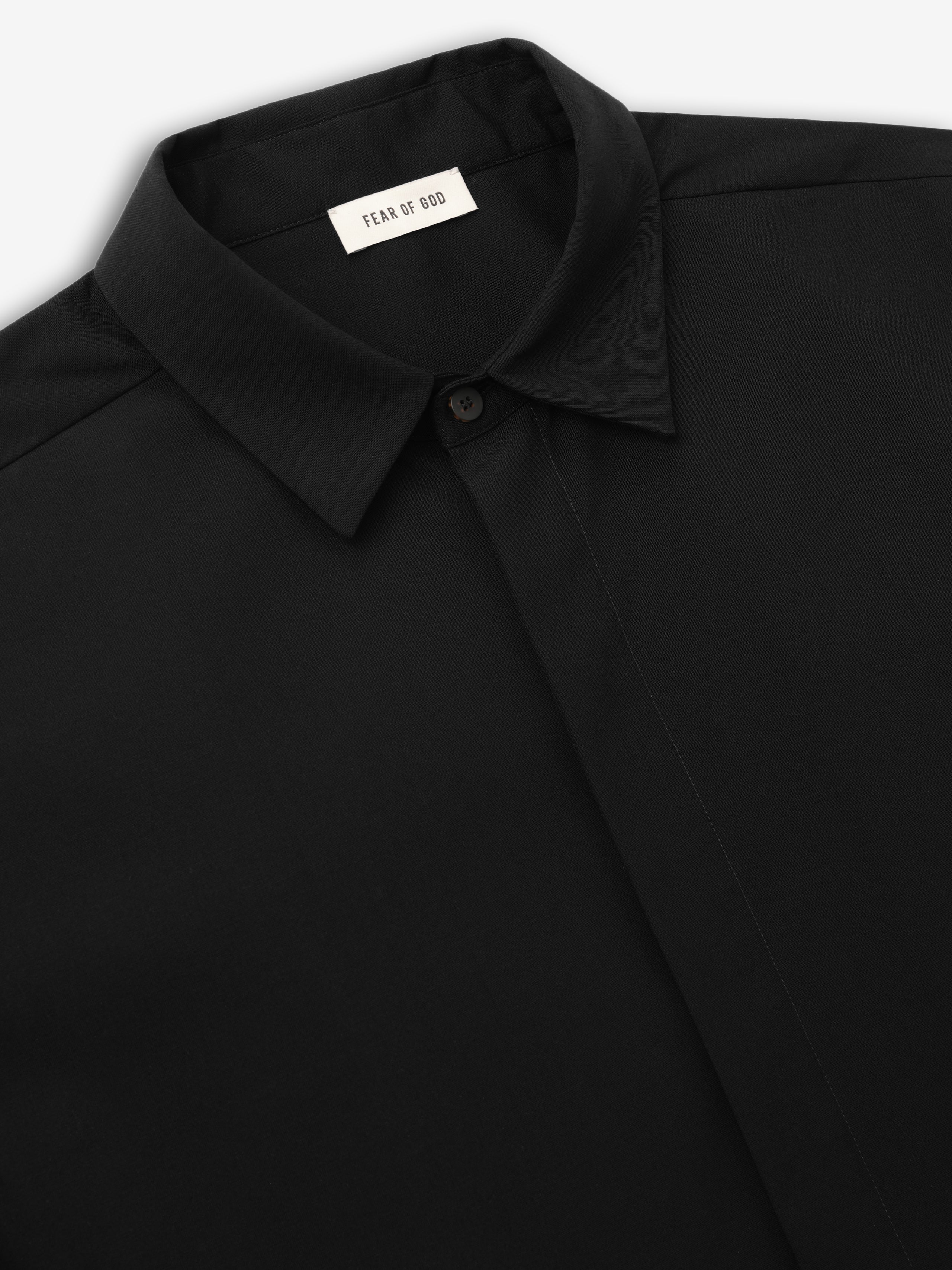 close-up of black cotton wool oxford classic shirt with pointed collar and hidden button placket detail