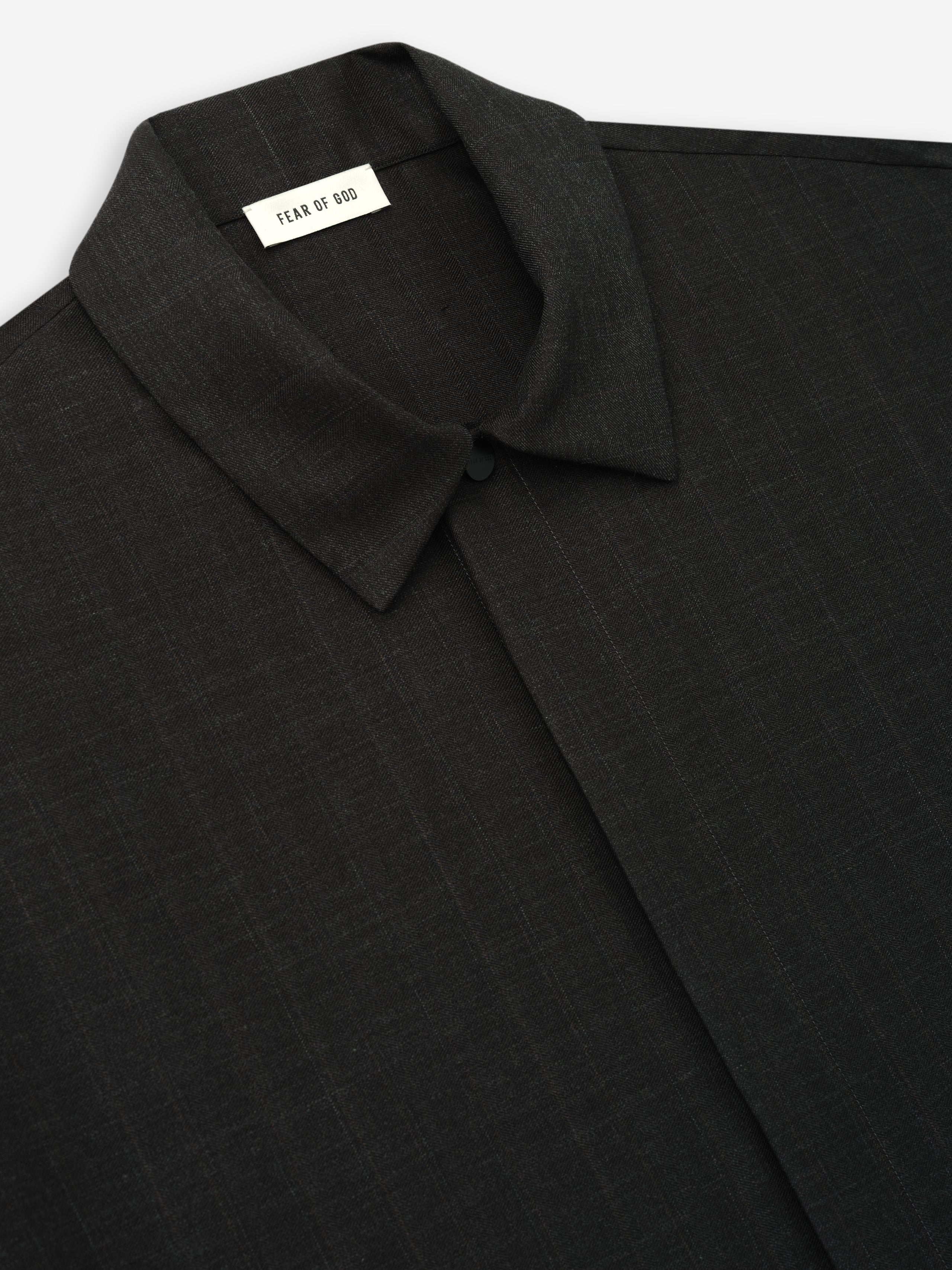 Dark grey shirt with subtle stripe pattern, classic pointed collar, and concealed button placket on smooth fabric