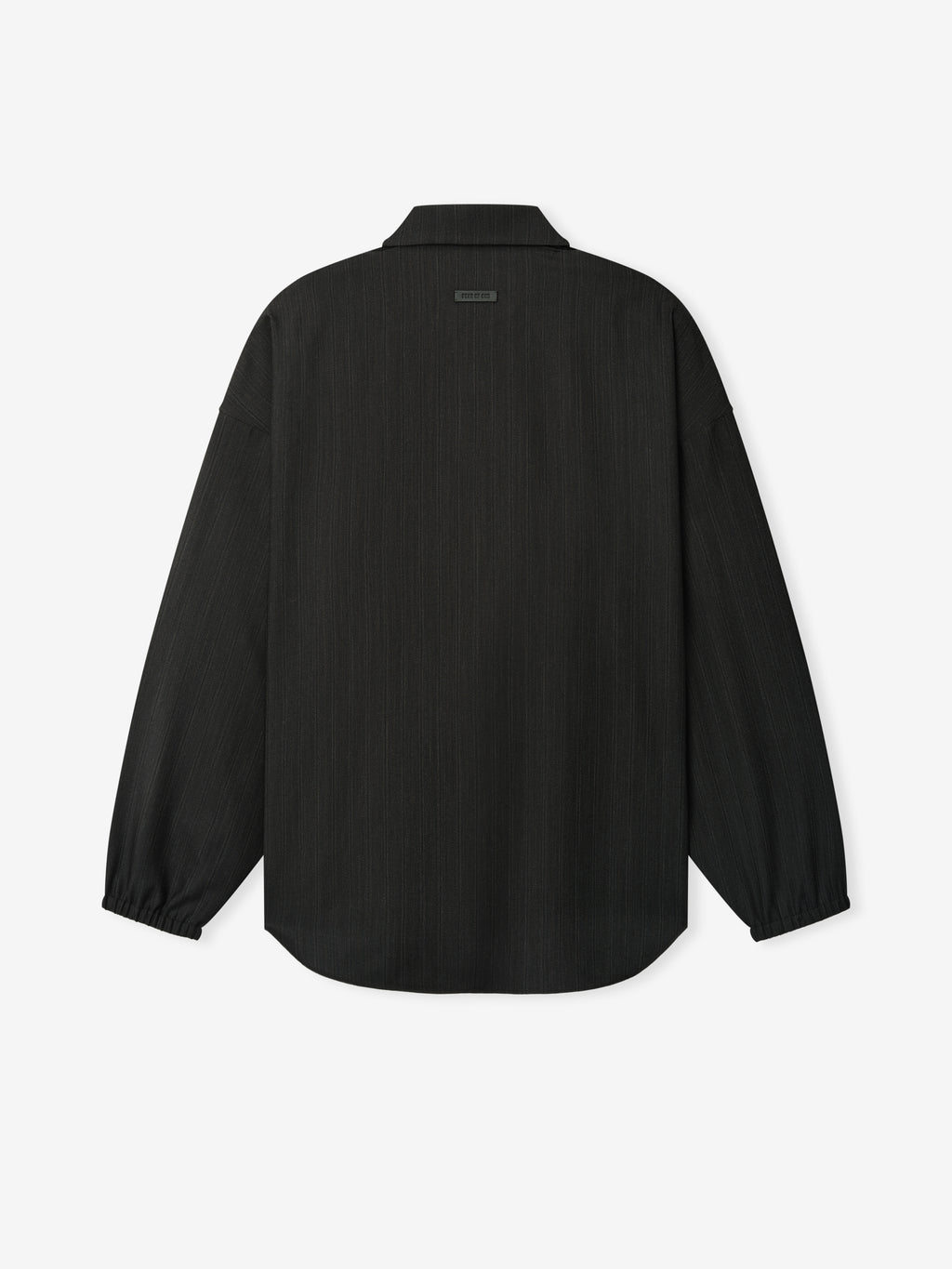 back view of relaxed fit striped wool shirt with elasticated cuffs and curved hem on plain white background