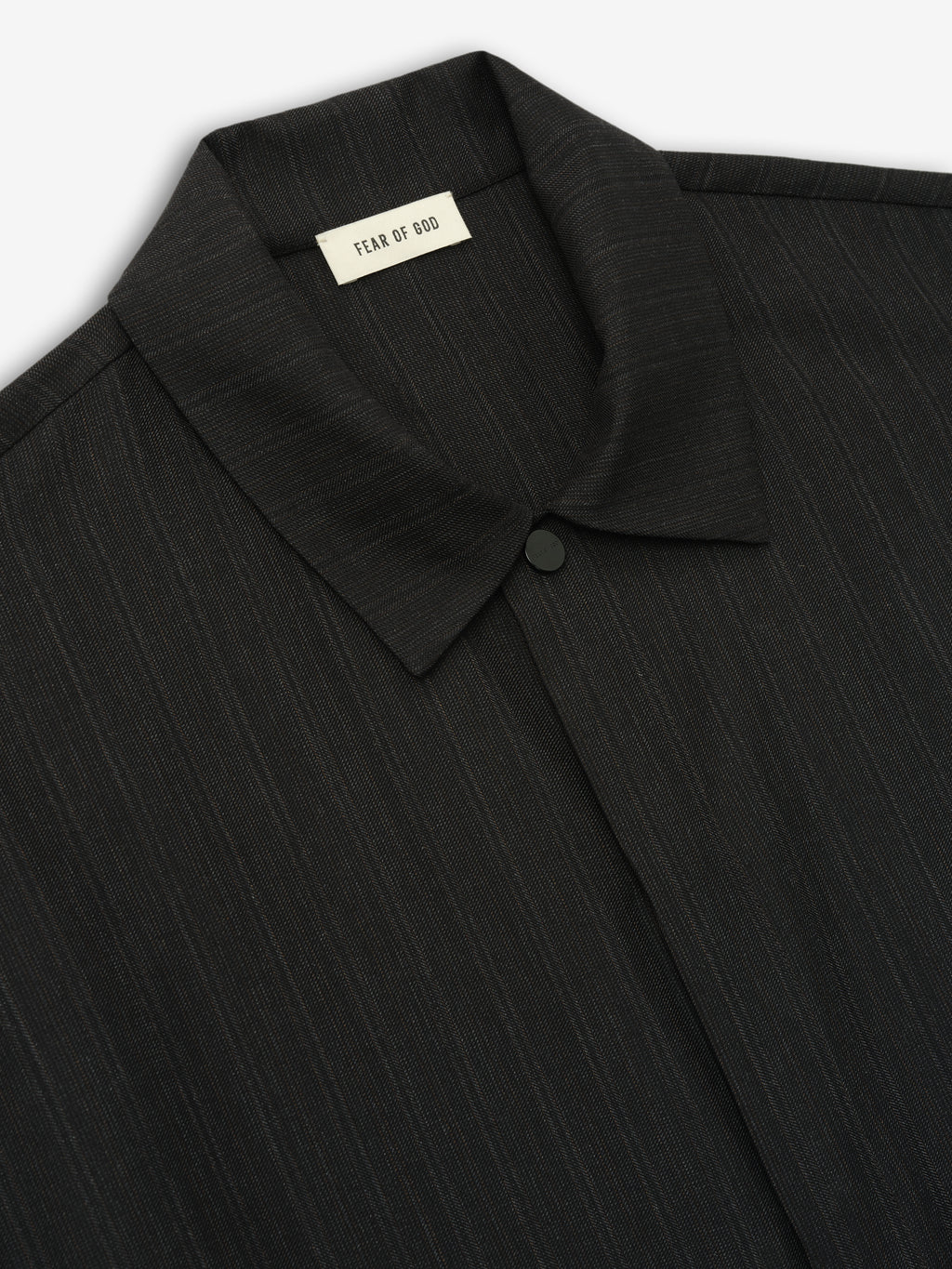 close-up of black super fine yarn-dyed wool shirt with subtle stripes, pointed collar, and concealed button front closure