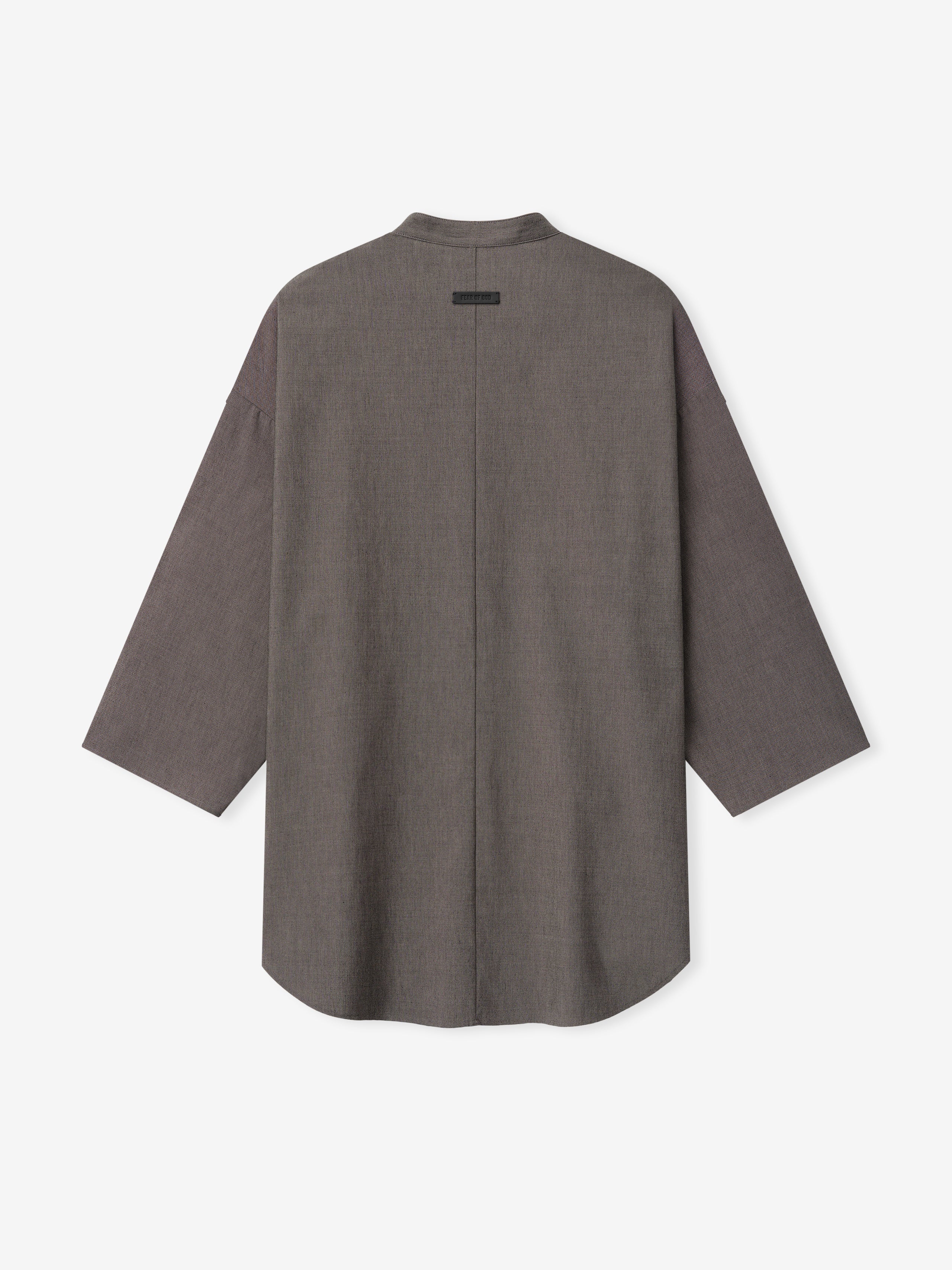 back view of relaxed fit cotton-wool oxford shirt with mandarin collar and long sleeves in muted brown tone
