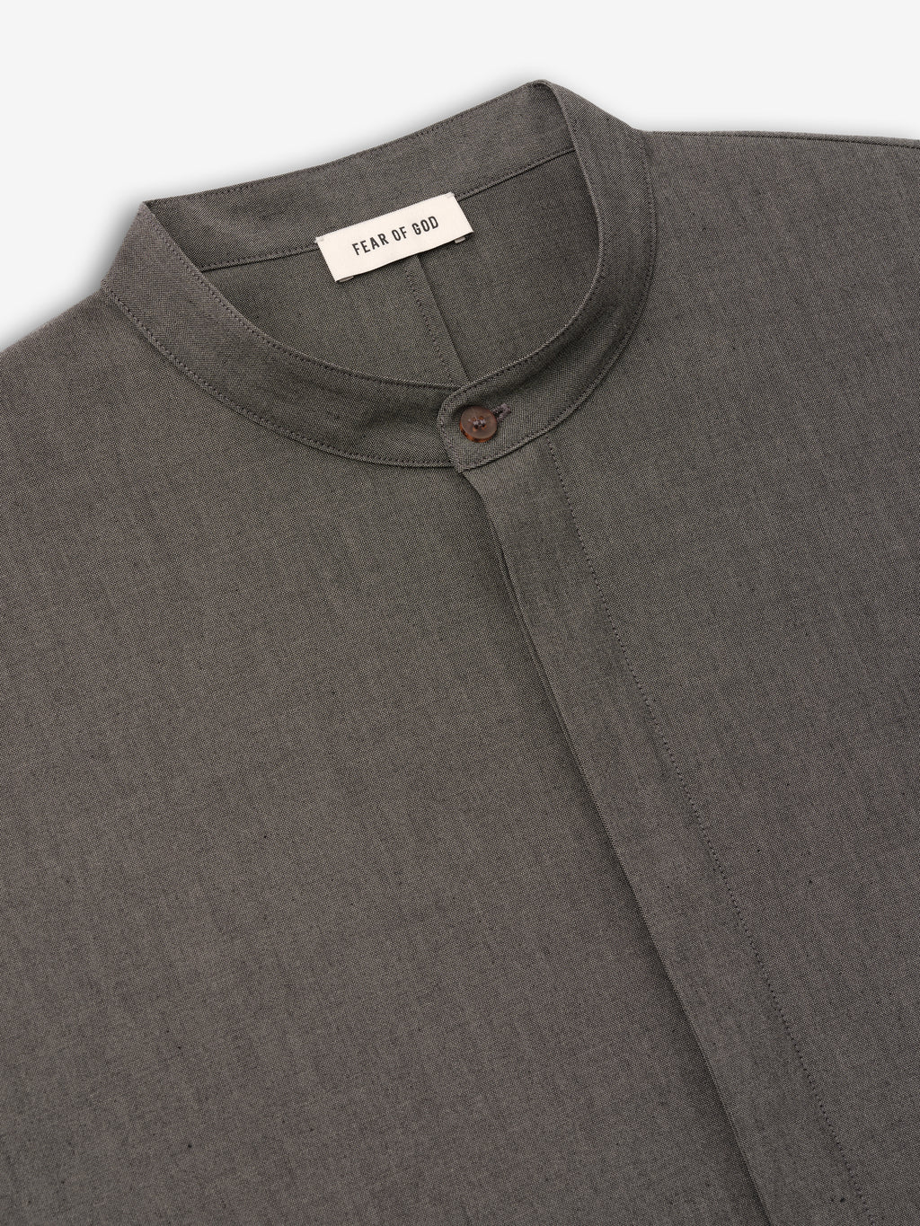 close-up of charcoal grey cotton-wool oxford shirt with mandarin collar and single button closure