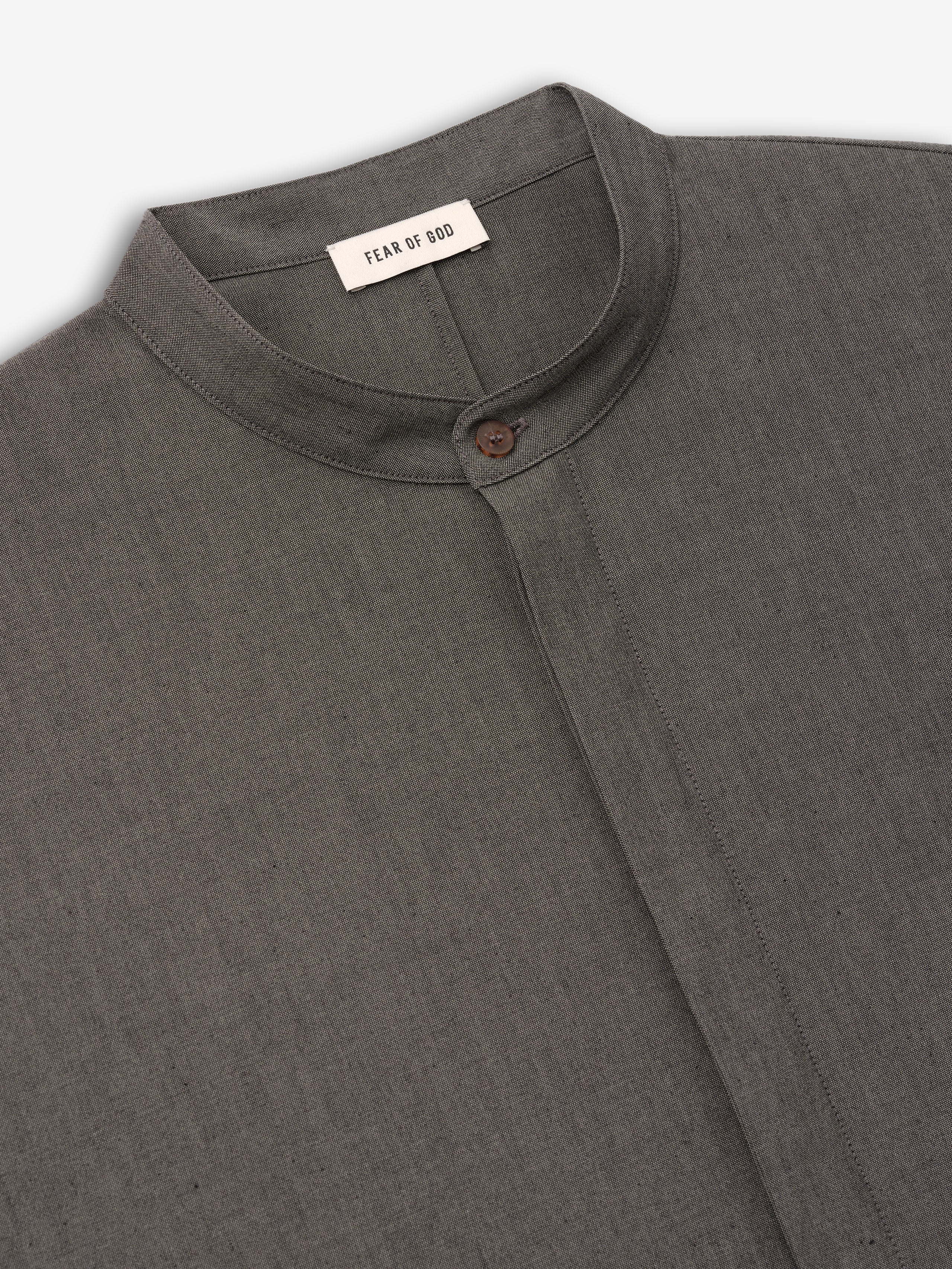 close-up of charcoal grey cotton-wool oxford shirt with mandarin collar and single button closure