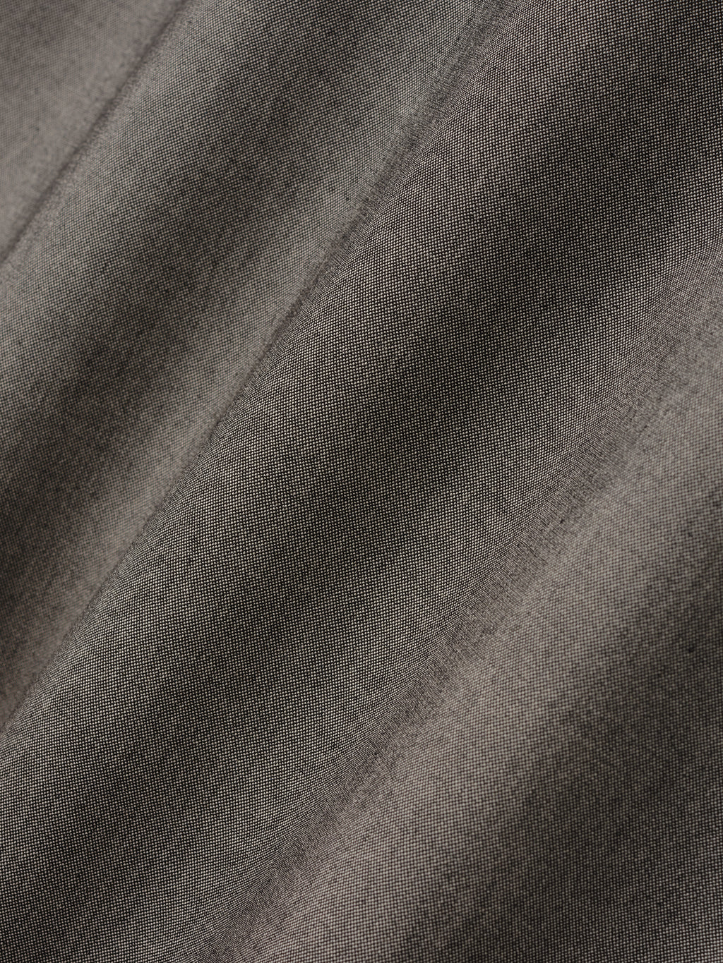 close-up texture of muted taupe cotton-wool oxford fabric with subtle weave and soft drape