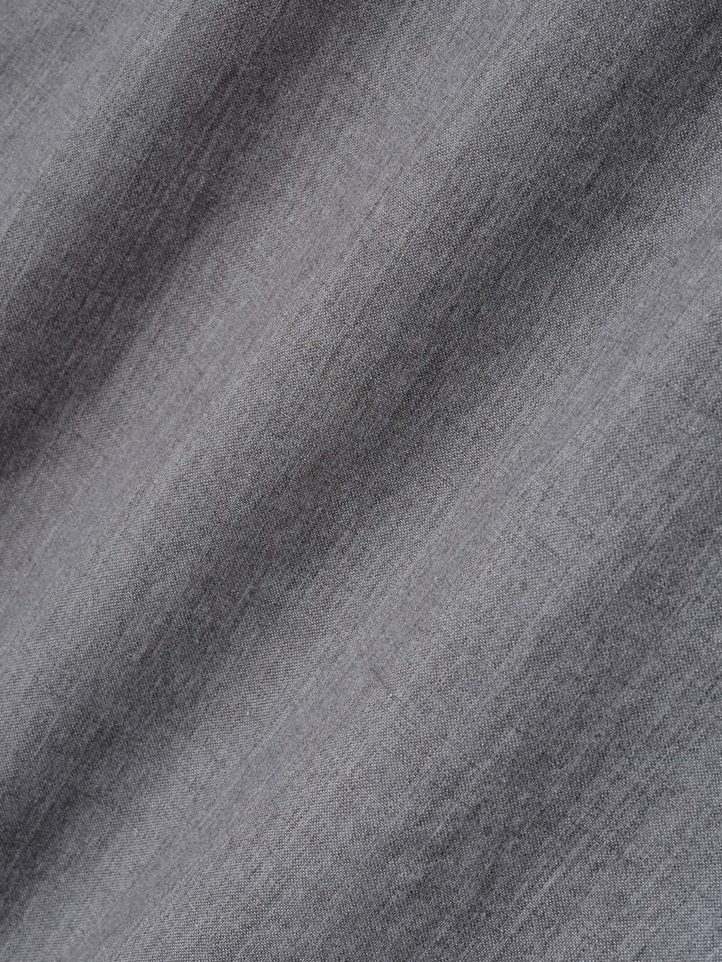 close-up of light grey washed virgin wool-linen fabric with soft texture and subtle woven details