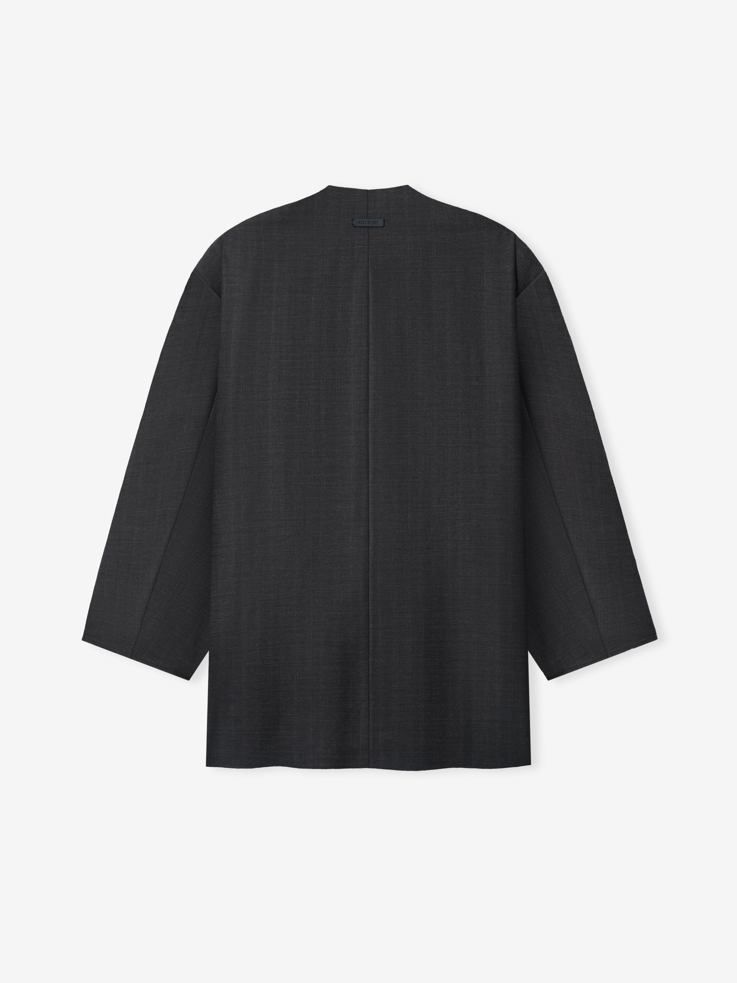 Back view of a black long-sleeve jacket with straight cut and minimalistic design on a white background
