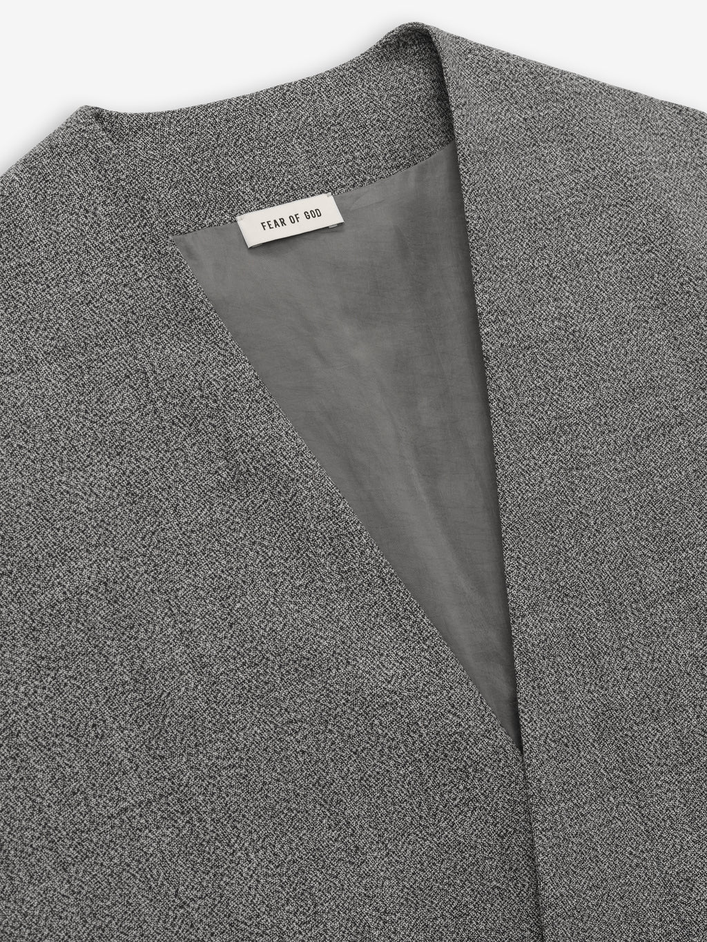 close-up of grey virgin wool mouliné fabric with lapelless neckline and smooth Bemberg cupro lining inside jacket