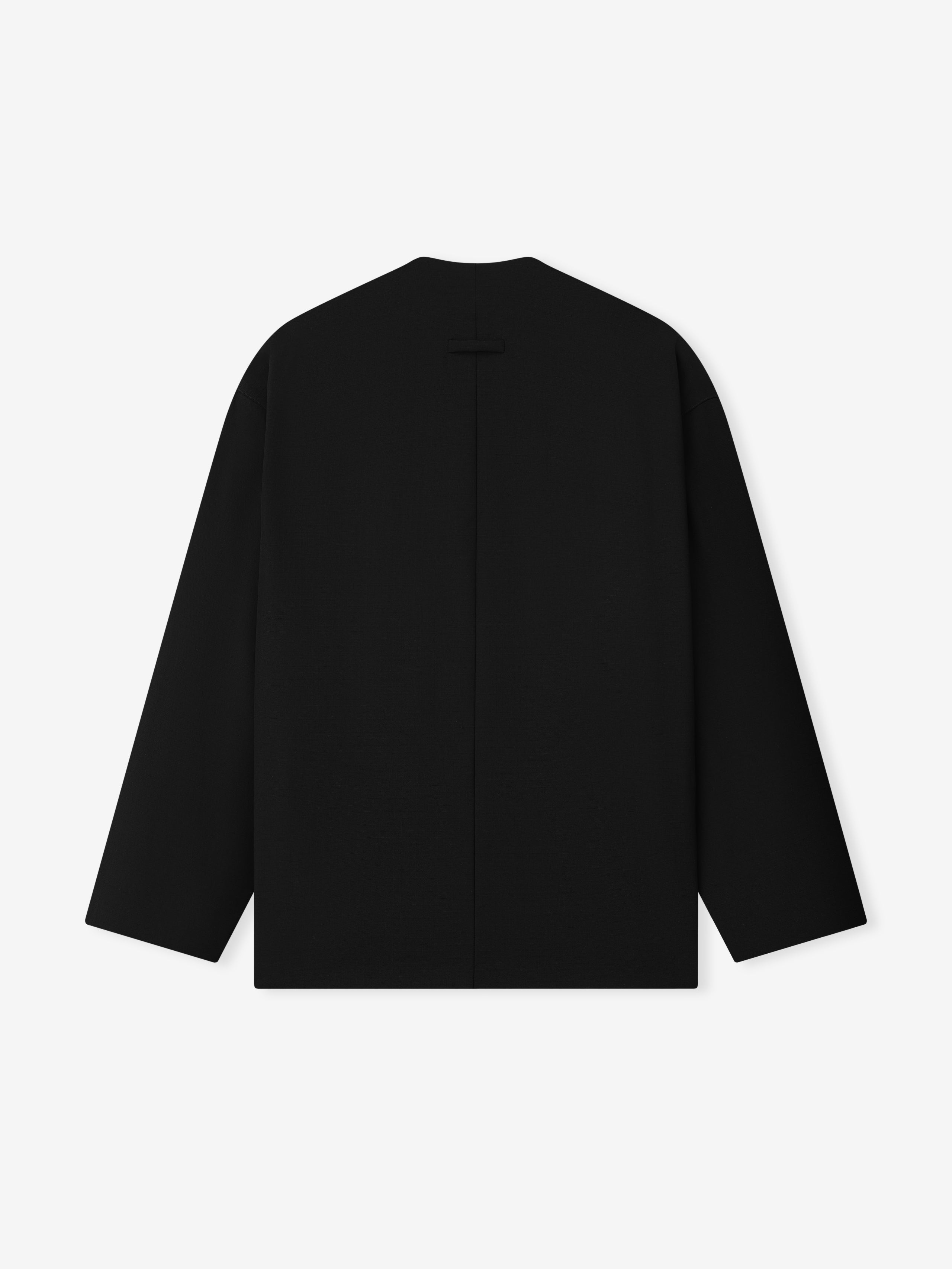 back view of relaxed lapelless cropped jacket in lightweight black wool canvas with clean lines and long sleeves