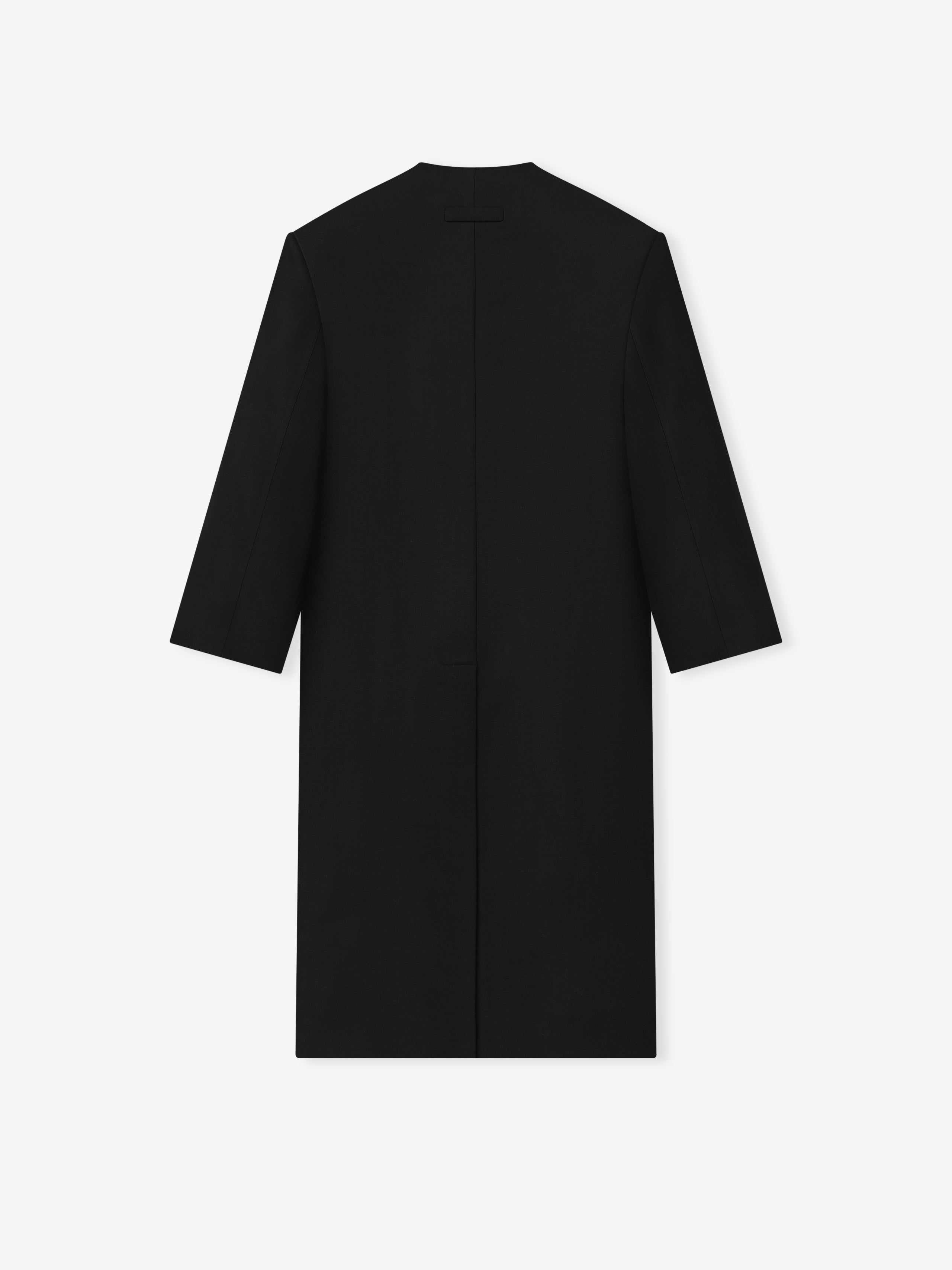 back view of black double weave virgin wool lapelless coat with clean lines and sculptural volume