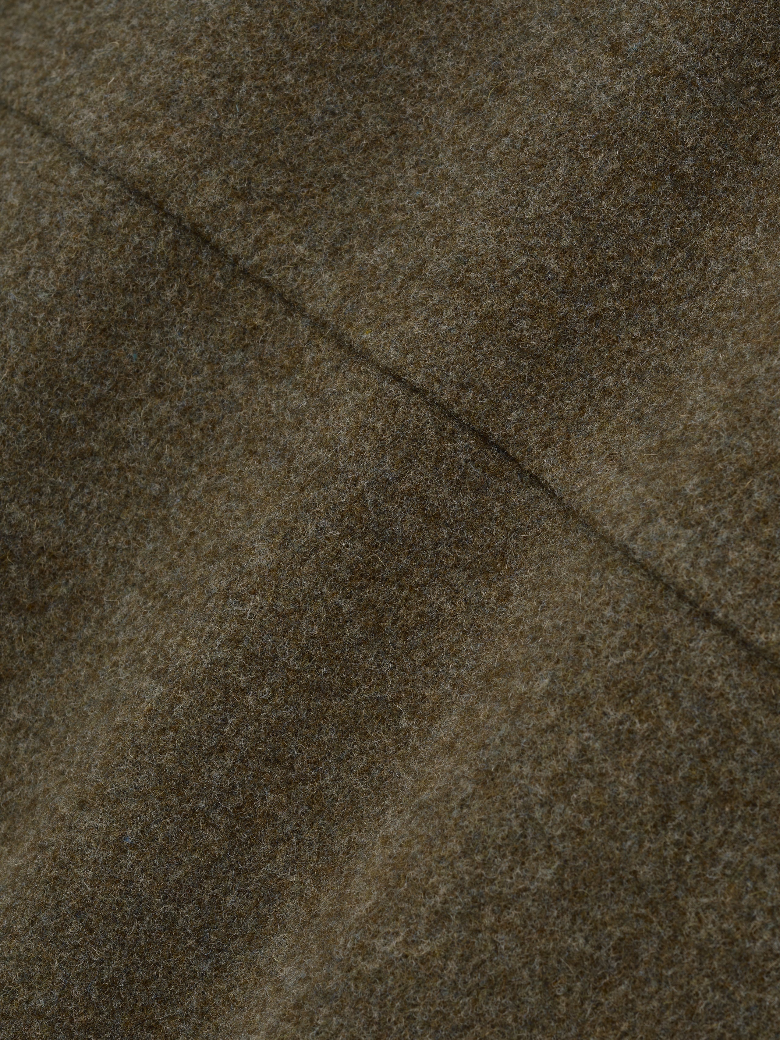 close-up of olive brown double-face wool-cashmere fabric showing soft texture and fine stitching detail