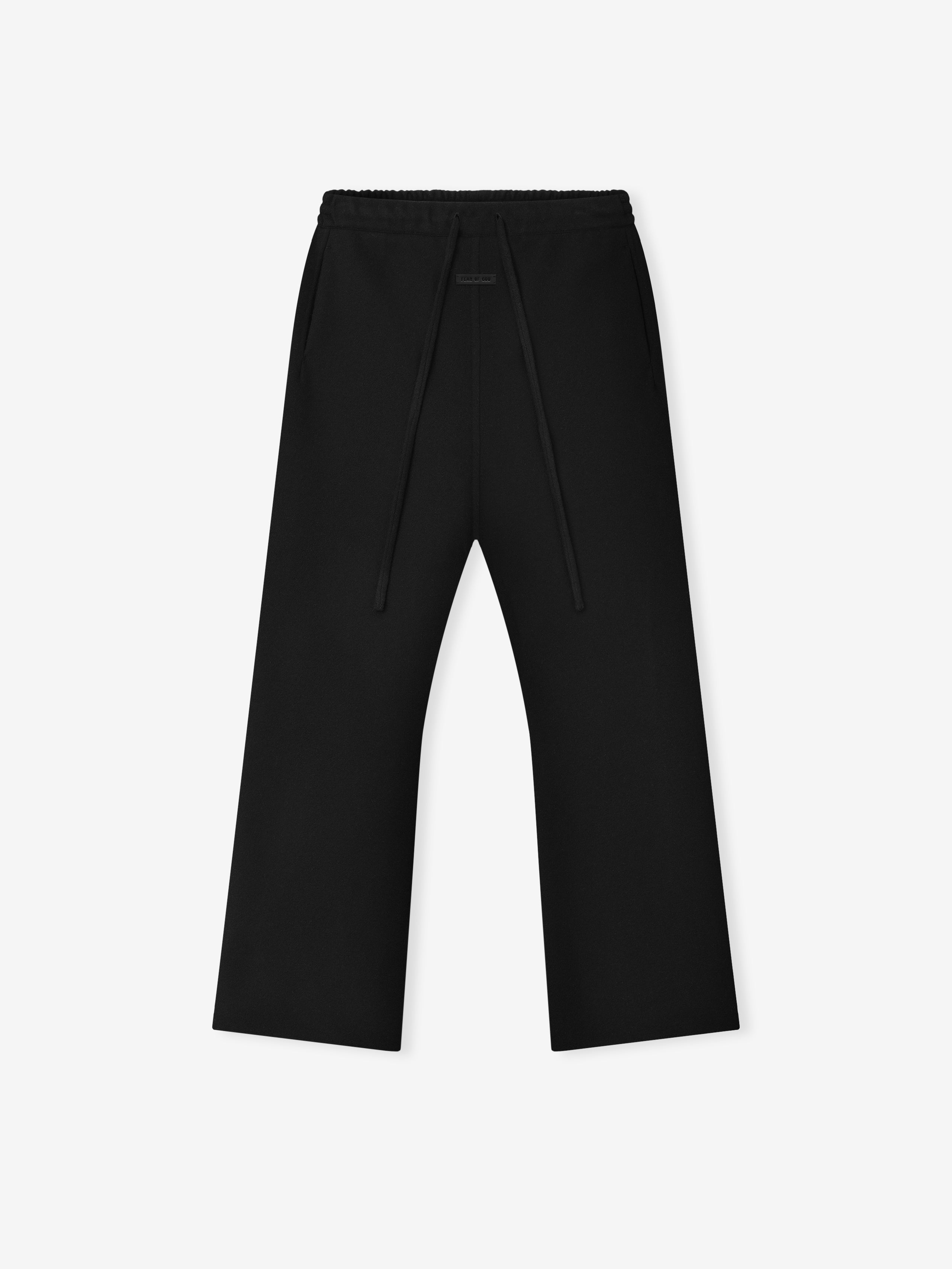 black wool cashmere blend flared pants with elastic waistband and drawstring detail laid flat on white background