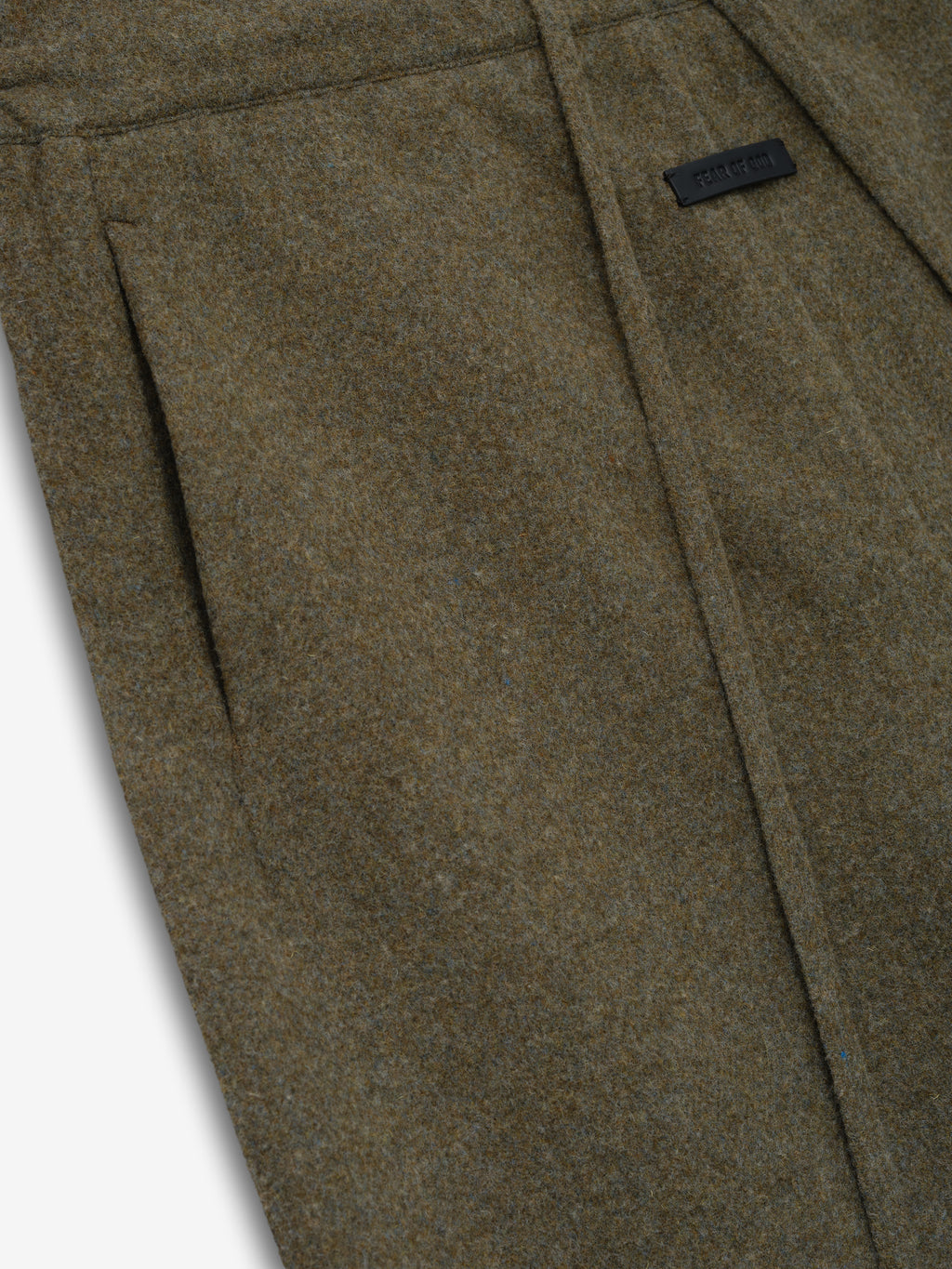 close-up of olive brown double-face wool cashmere fabric with pocket and subtle textured finish detail