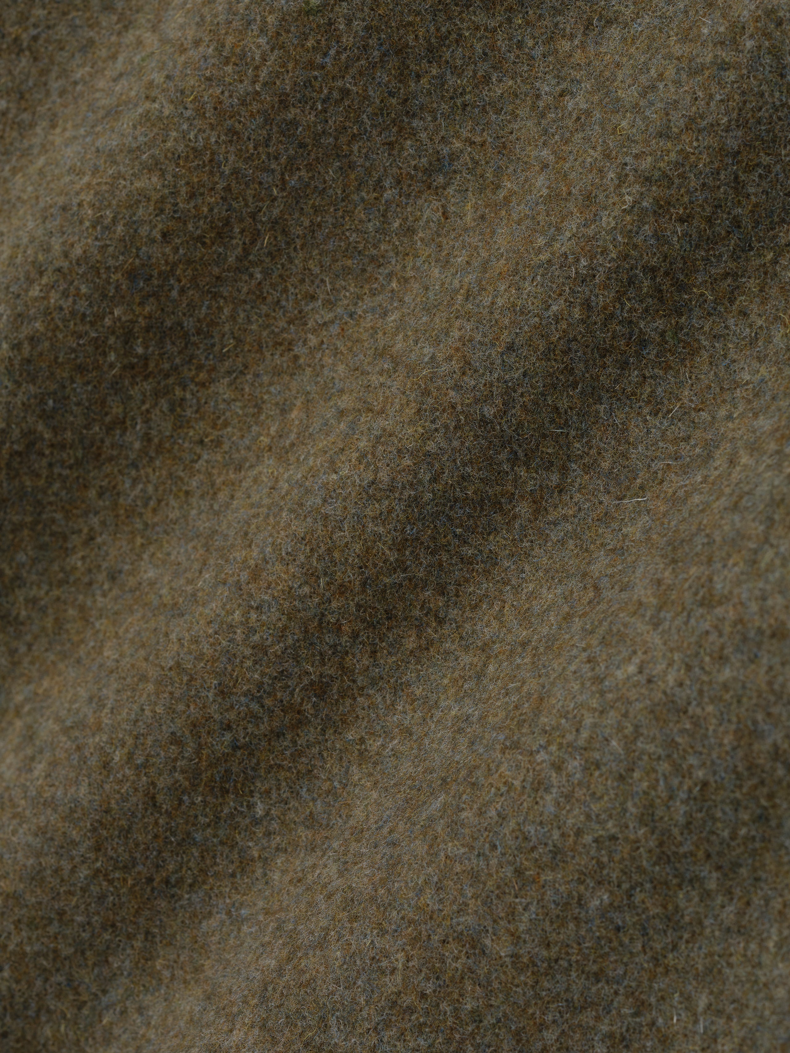 close-up of textured olive wool and cashmere blend fabric showing soft compact weave and subtle color variation