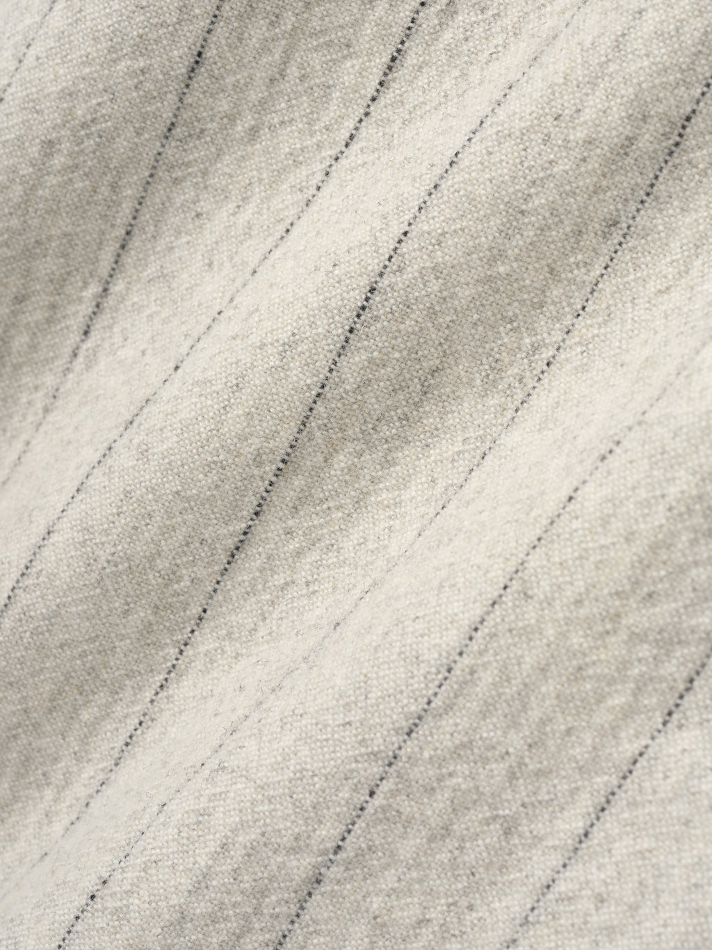 close-up of pinstriped double face wool nylon fabric in light beige with fine vertical lines and soft texture