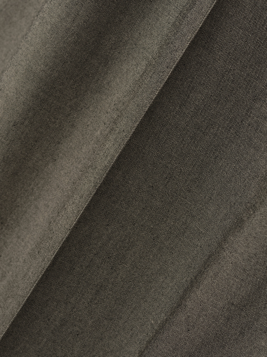 close-up of textured olive cotton wool oxford fabric with subtle weave pattern and soft matte finish