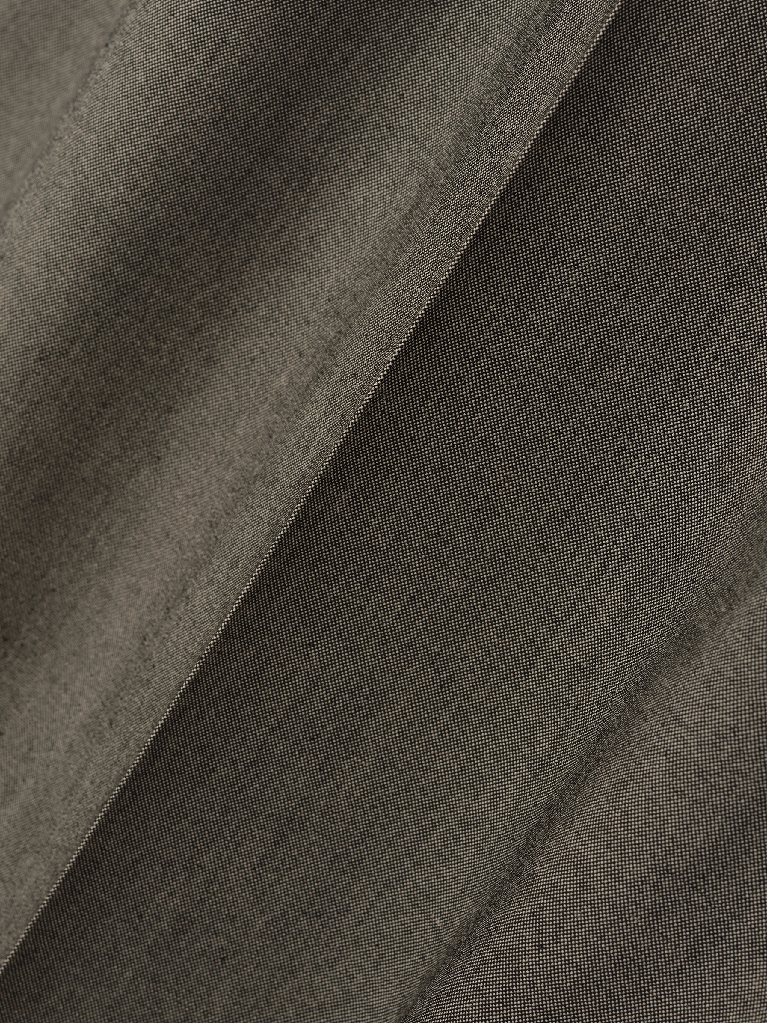 close-up of textured olive cotton wool oxford fabric with subtle weave pattern and soft matte finish