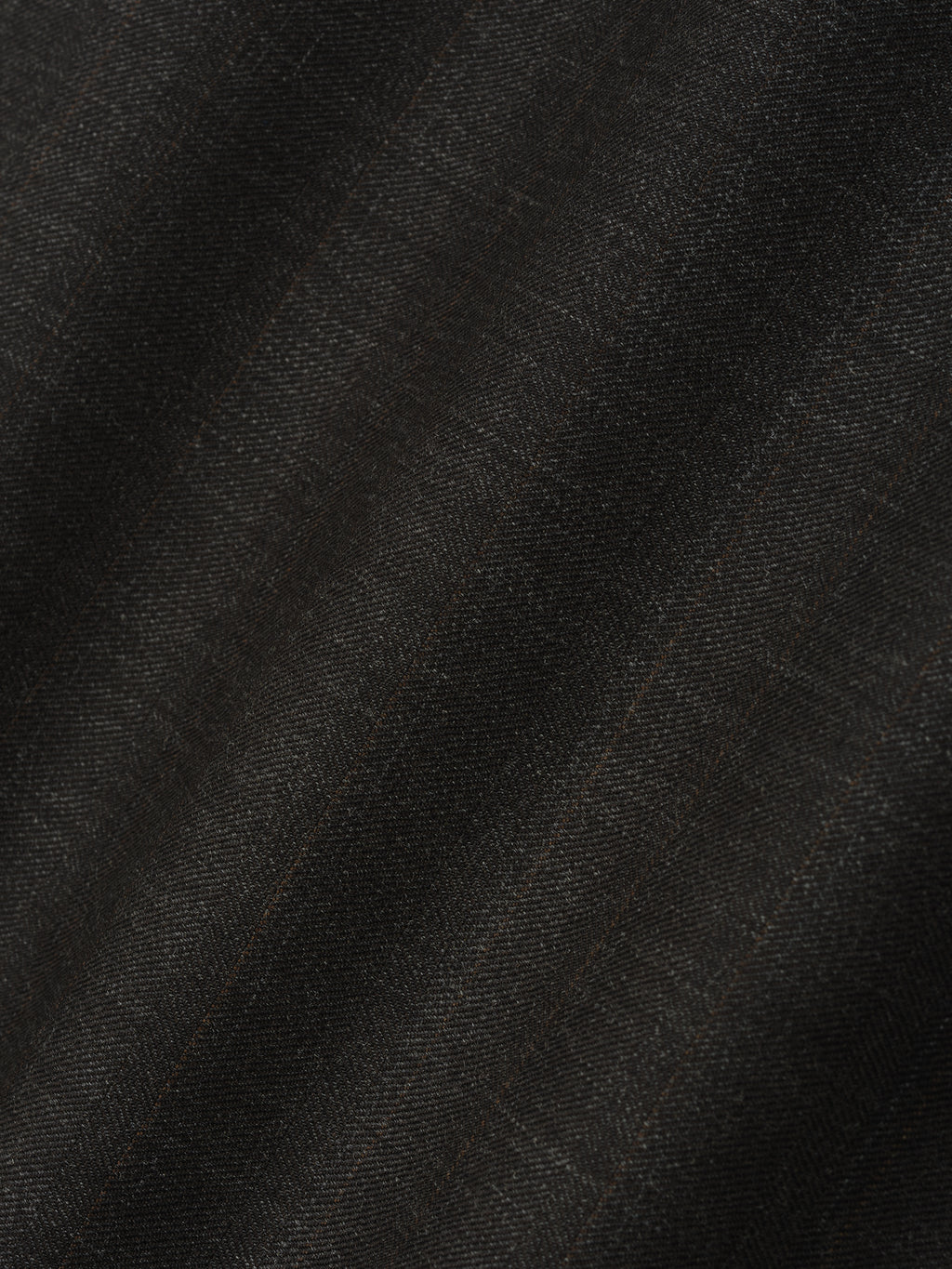 close-up of dark brown super fine yarn-dyed wool fabric with subtle herringbone texture for wide-leg pants