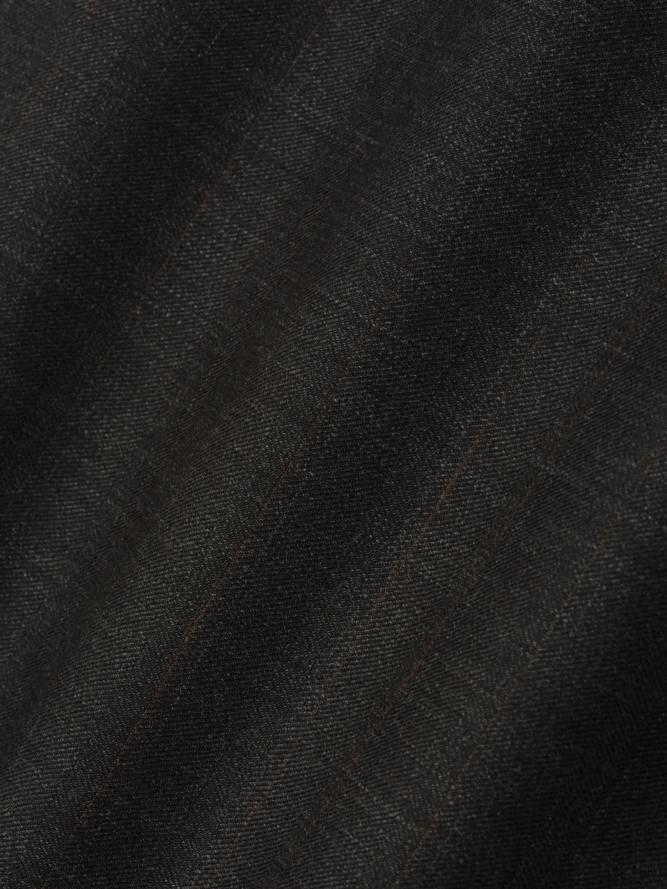 close-up of dark brown super fine yarn-dyed wool fabric with subtle herringbone texture for wide-leg pants