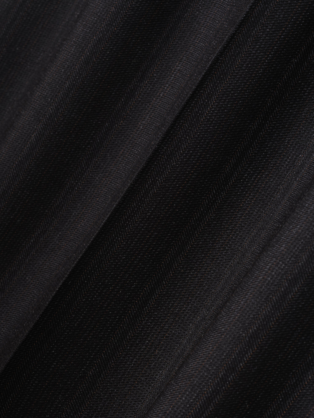 close-up of fine yarn-dyed wool fabric with subtle black stripes and soft matte finish for wide-leg pants