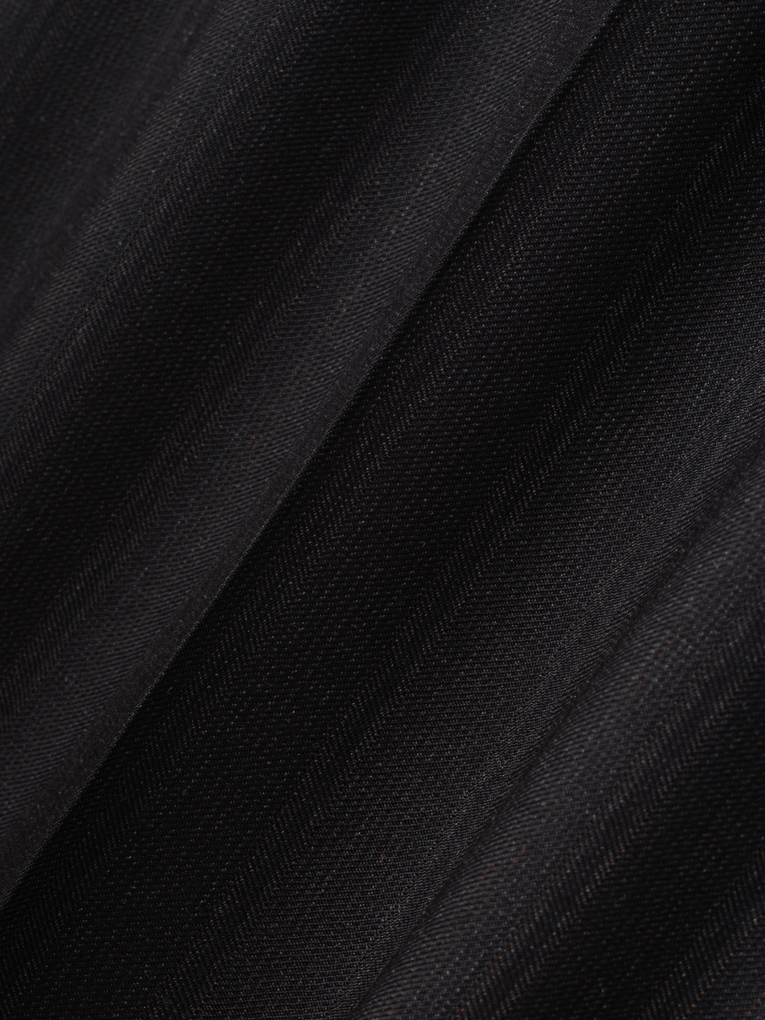 close-up of fine yarn-dyed wool fabric with subtle black stripes and soft matte finish for wide-leg pants