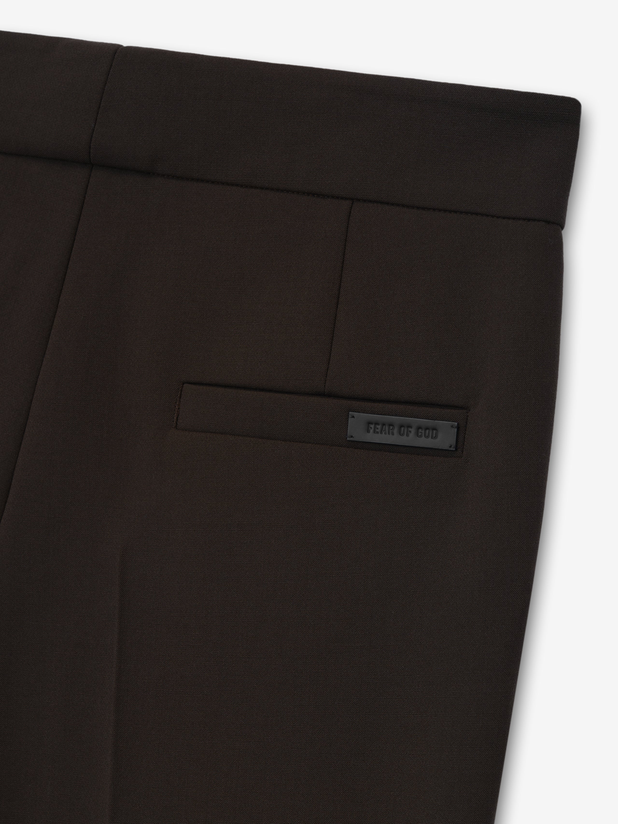 dark brown tailored double-weave virgin wool pants with welt pocket and subtle branded patch detail