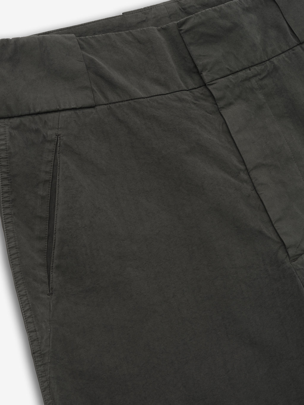 close-up of dark garment-dyed heavy cotton poplin casual short showing waistband and slant front pocket detail