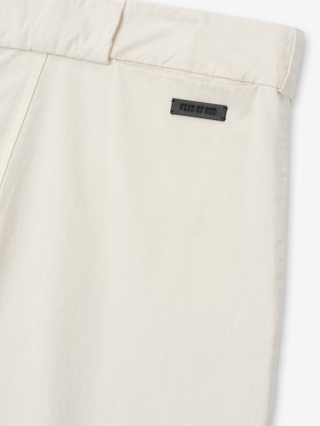 close-up of off-white garment-dyed heavy cotton poplin casual short back waistband with Fear of God label