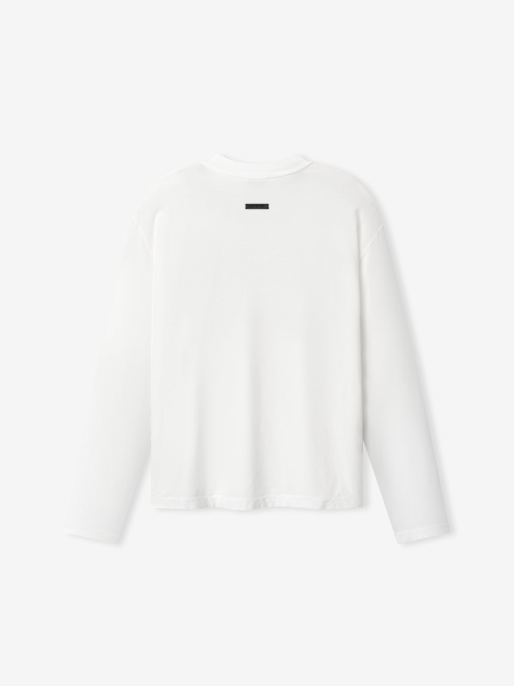 Back view of plain white long-sleeve shirt with small black rectangular detail near the neckline
