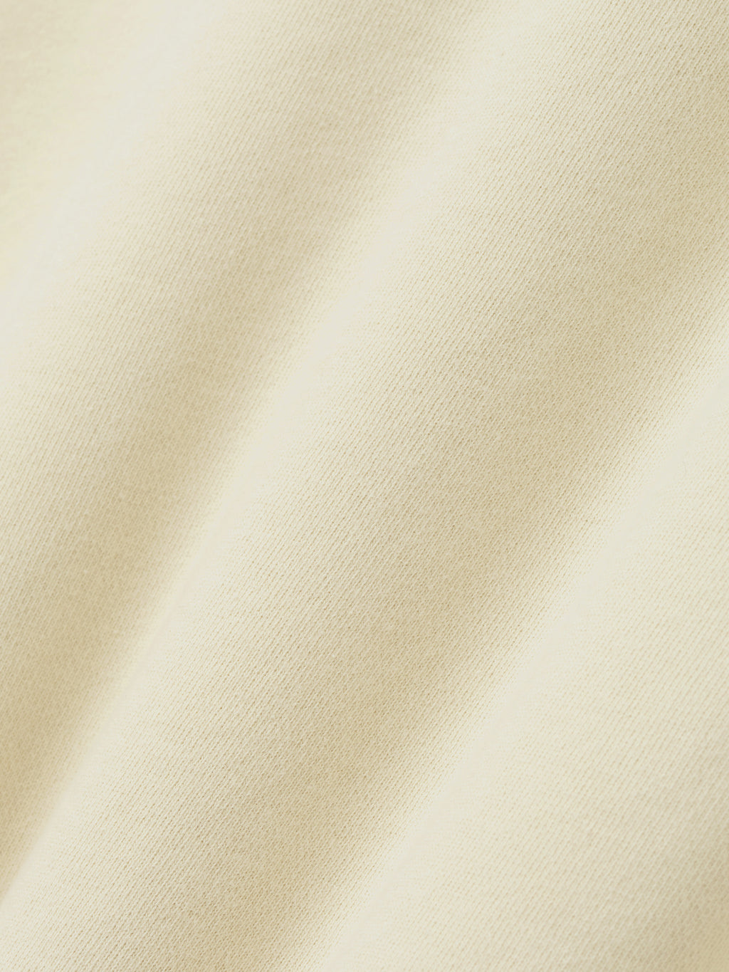 Close-up of a textured beige fabric surface