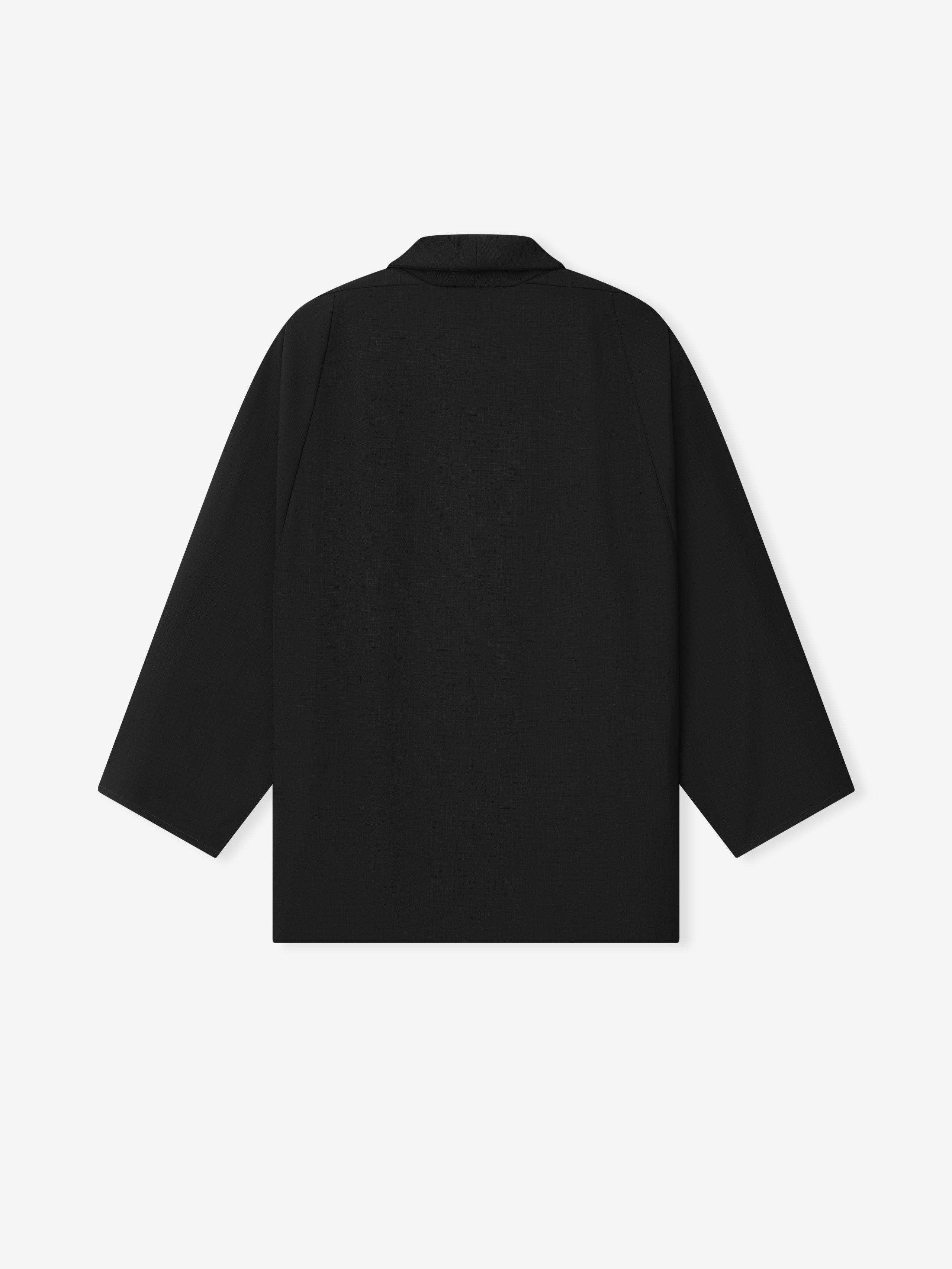 back view of black lightweight wool ripstop shawl collar jacket with relaxed fit and double-breasted snap closure