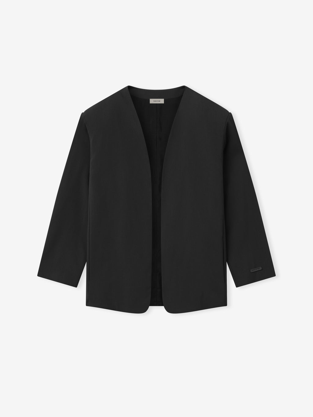 minimalist black collarless jacket with clean lines and open front design in smooth fabric