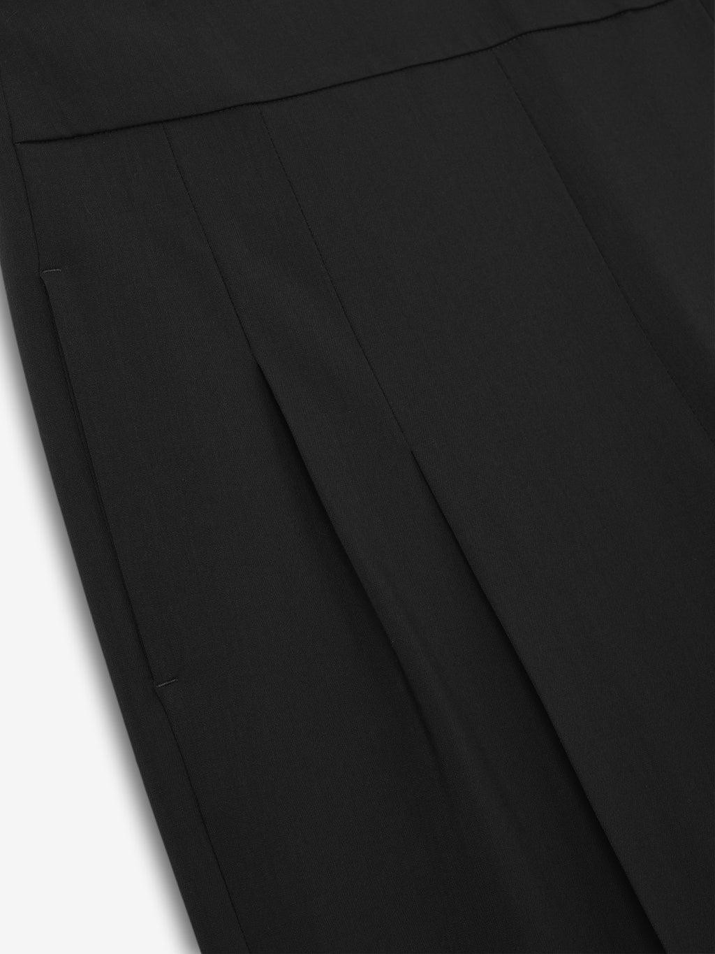 close-up of black wide leg pants front panel with vertical stitched seam detail in smooth fabric finish