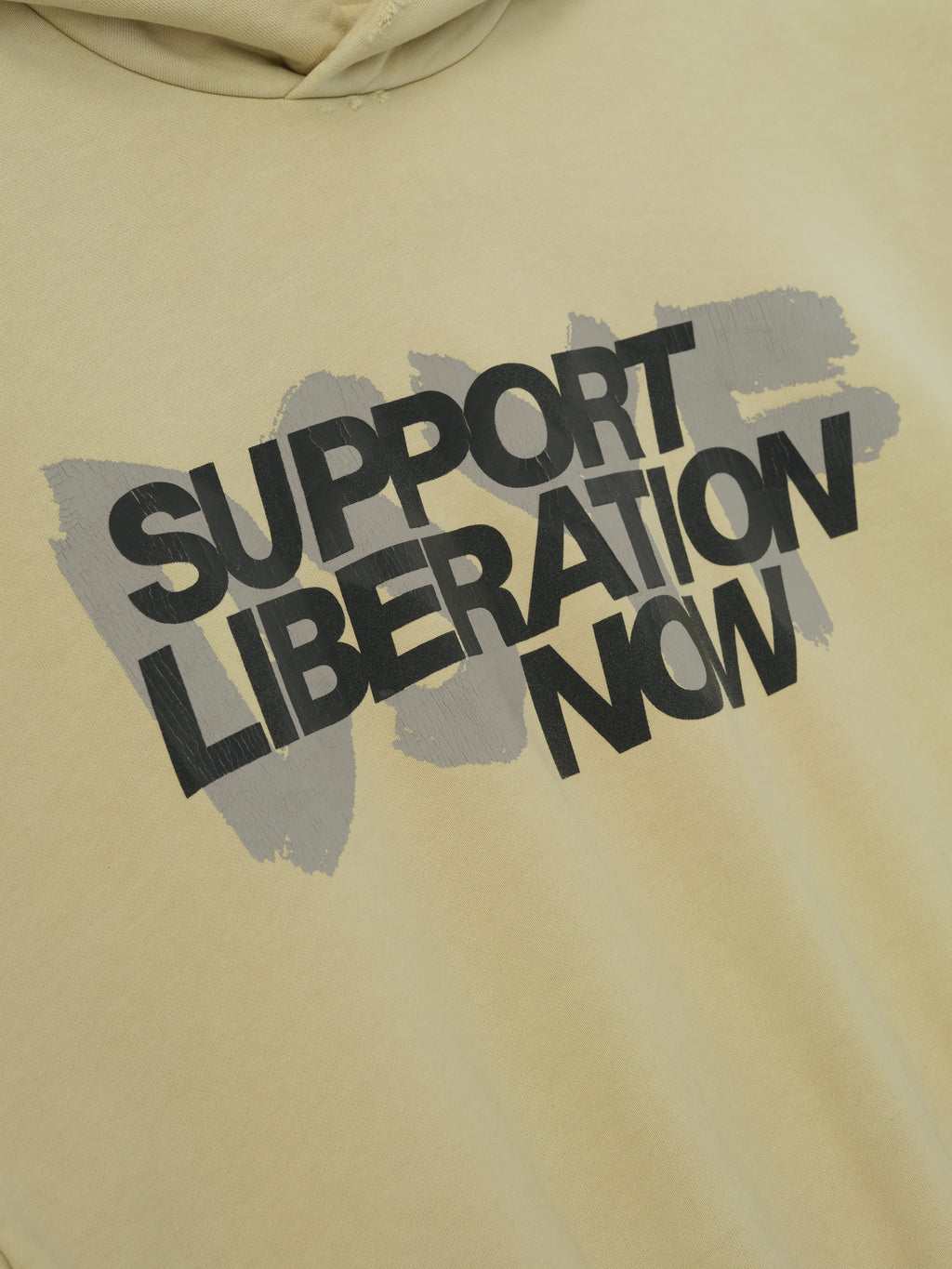 Close-up of clay Liberation Now Hoodie showing bold black "Support Liberation Now" text over gray brushstroke, gallery image 0