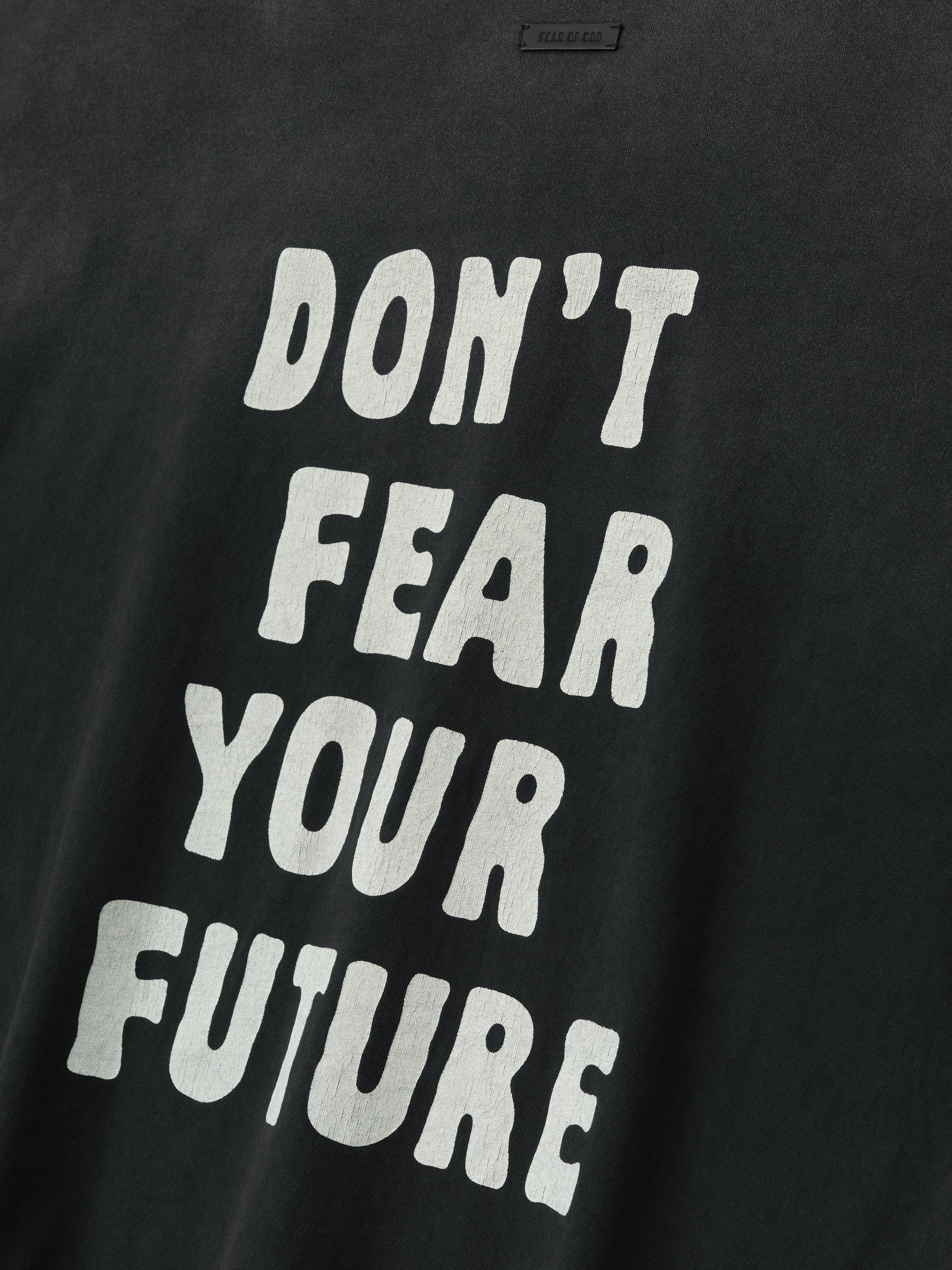 Close-up of black DSYF Tee with bold white text reading "DON'T FEAR YOUR FUTURE" centered on front chest area