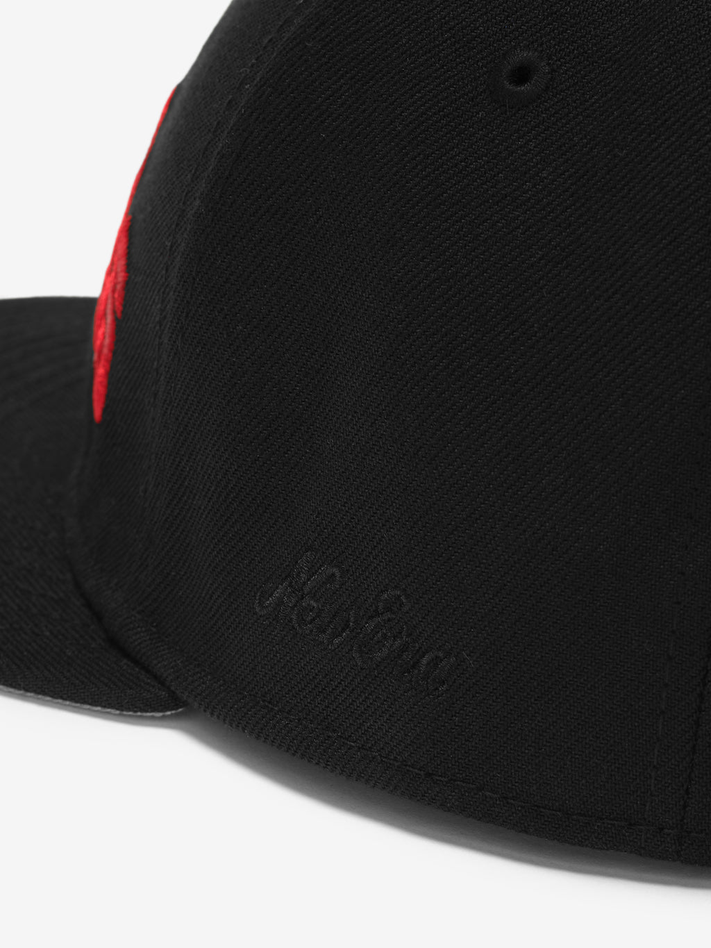 Close-up rear view of black Falcons 9Fifty RC Snapback highlighting subtle black embroidered New Era logo, gallery image 0