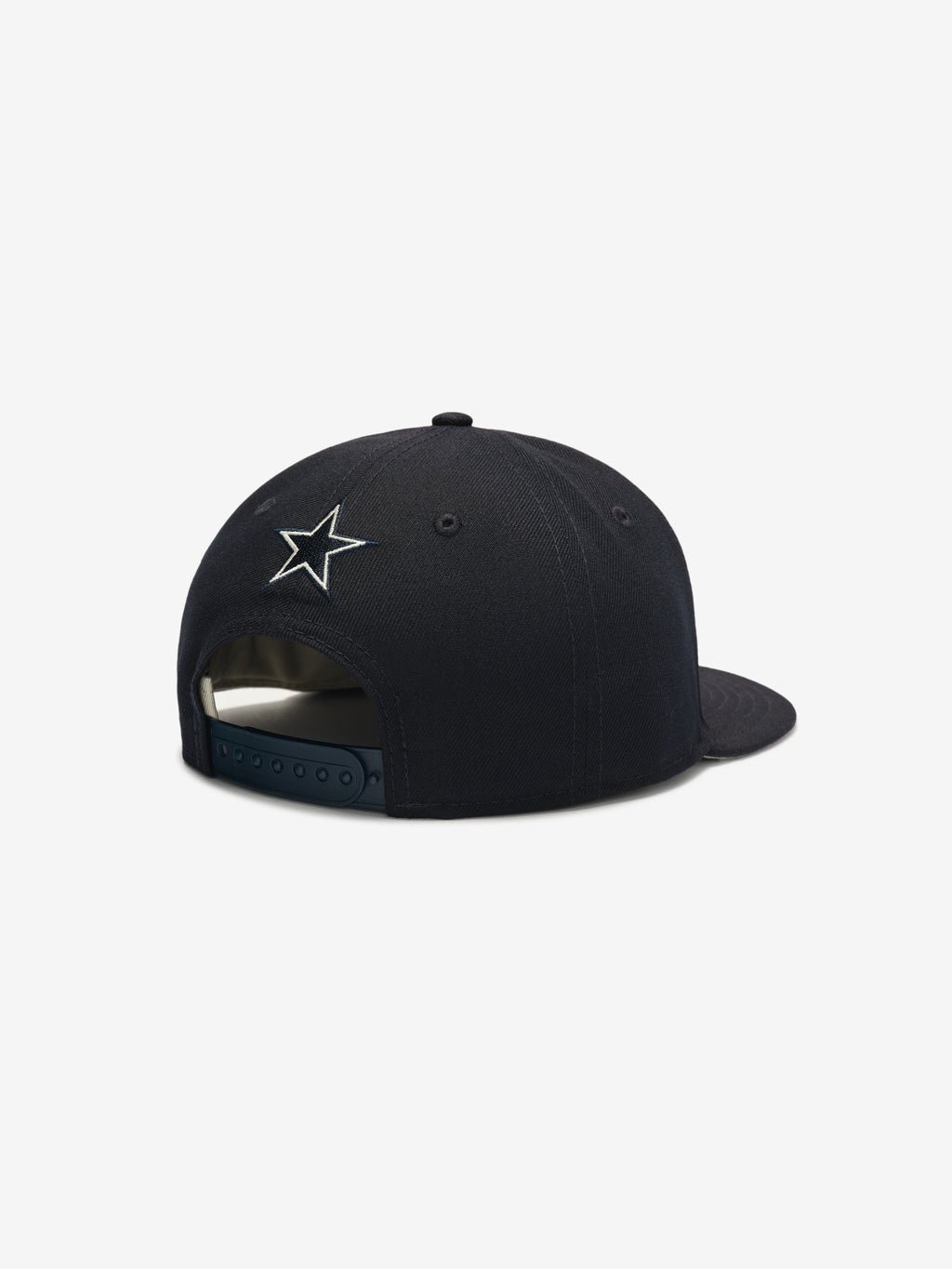 Rear angle of navy Cowboys 9Fifty RC Snapback highlighting embroidered star logo and adjustable snap closure, gallery image 0