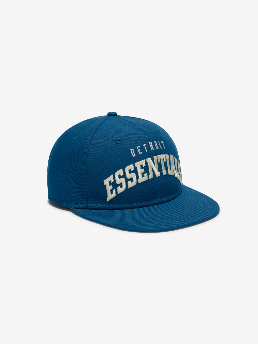 Angled front view of blue Lions 9Fifty RC Snapback with raised white Detroit Essentials embroidery, gallery image 0