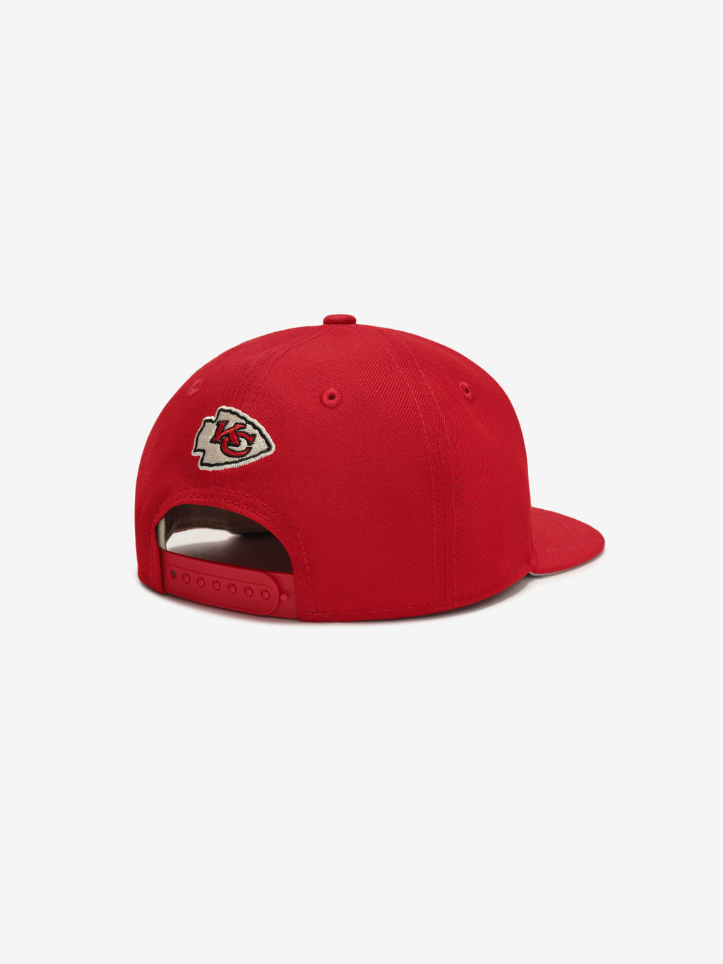 Rear angled view of red Chiefs 9Fifty RC Snapback highlighting embroidered team logo above adjustable snapback closure, gallery image 0
