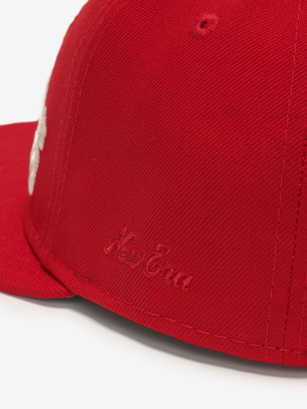 Close-up angled view of red Chiefs 9Fifty RC Snapback showing subtle embroidered New Era logo on side panel, gallery image 0