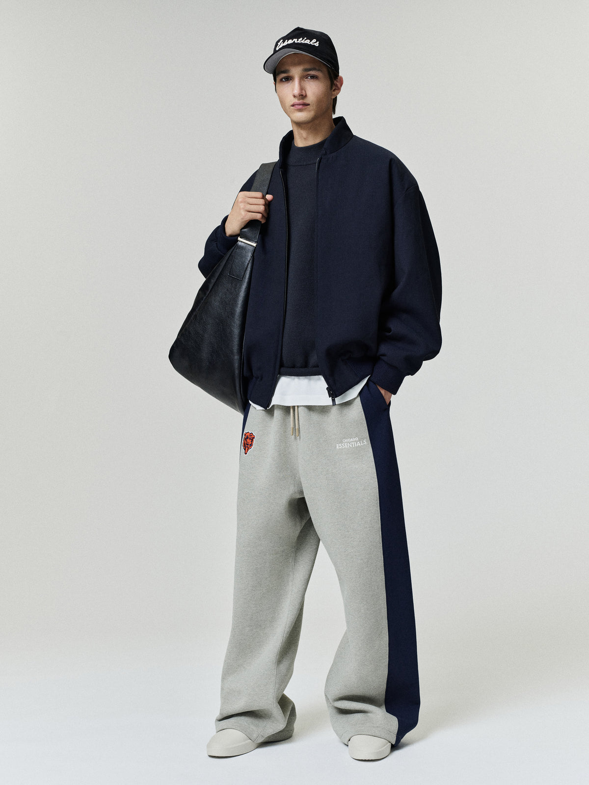 Bears Lounge Sweatpant in gray fleece with navy side panels and relaxed straight leg fit styled on a model as a Bottoms product view