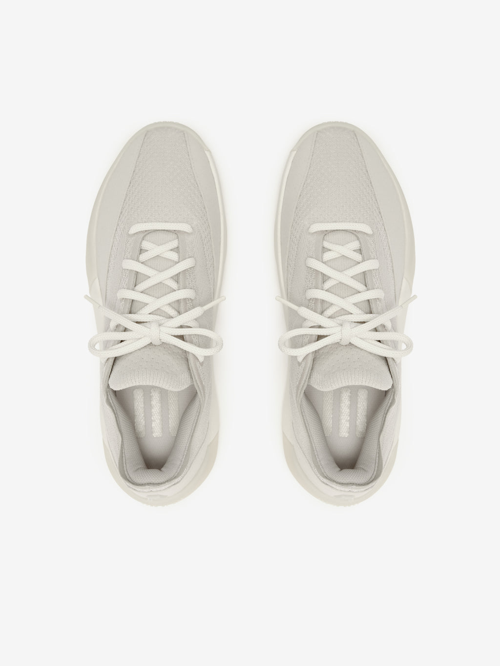 Pair of light gray sneakers on a white background