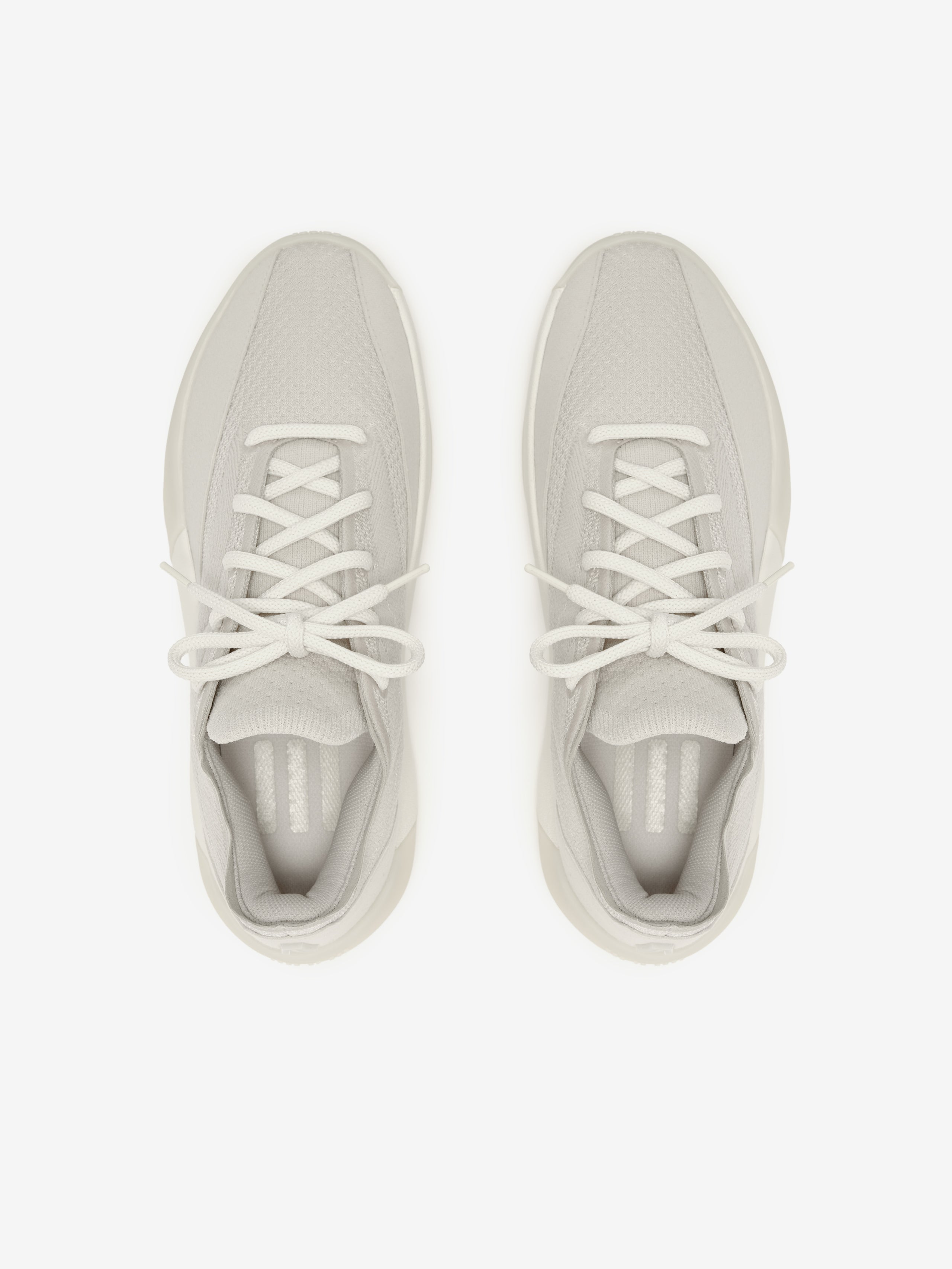 Pair of light gray sneakers on a white background